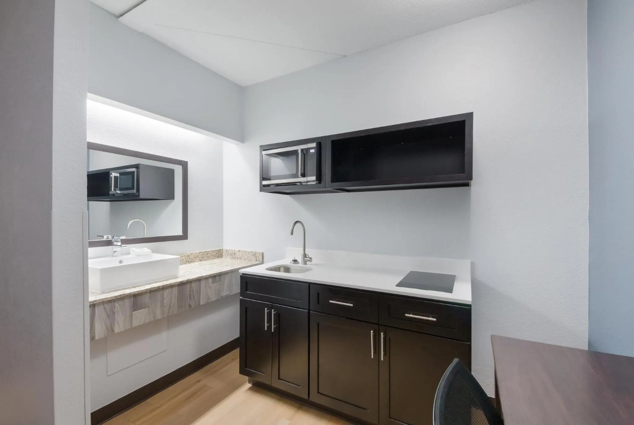 Bedroom in HomeTowne Studios by Red Roof San Antonio - SeaWorld Northwest