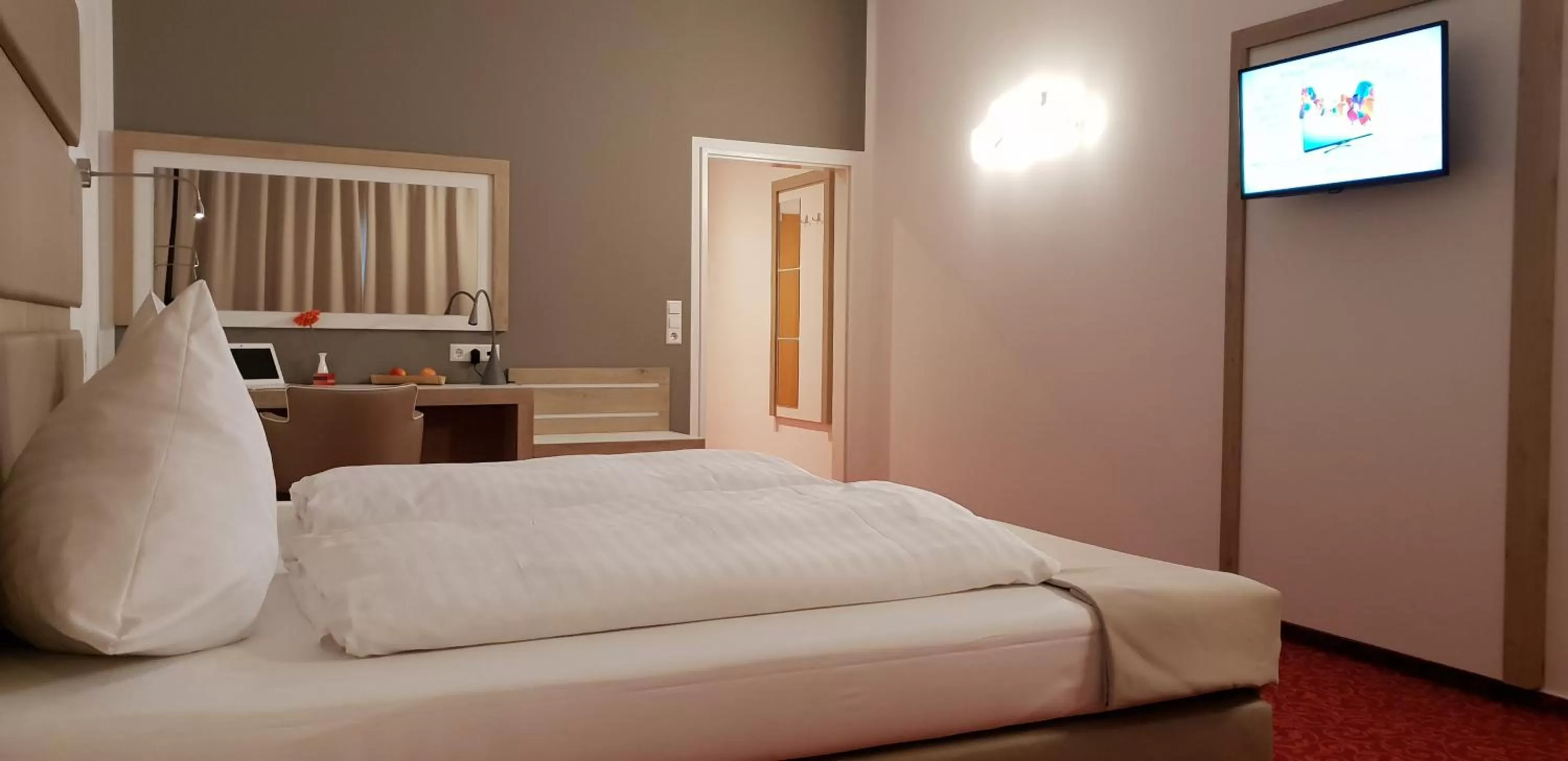 Bed in Confour Hotel