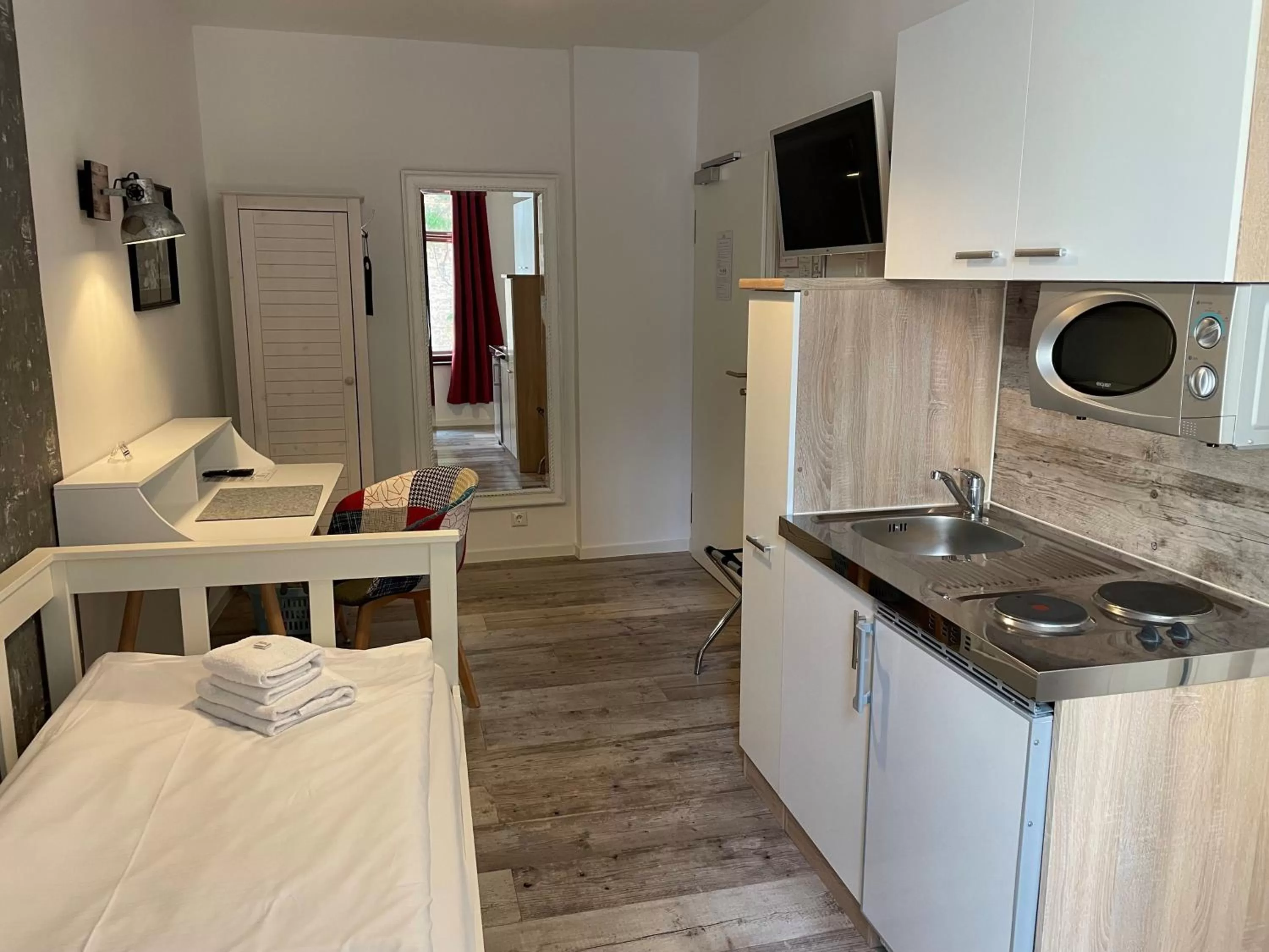 Kitchen or kitchenette in Aparthotel Walhalla Potsdam