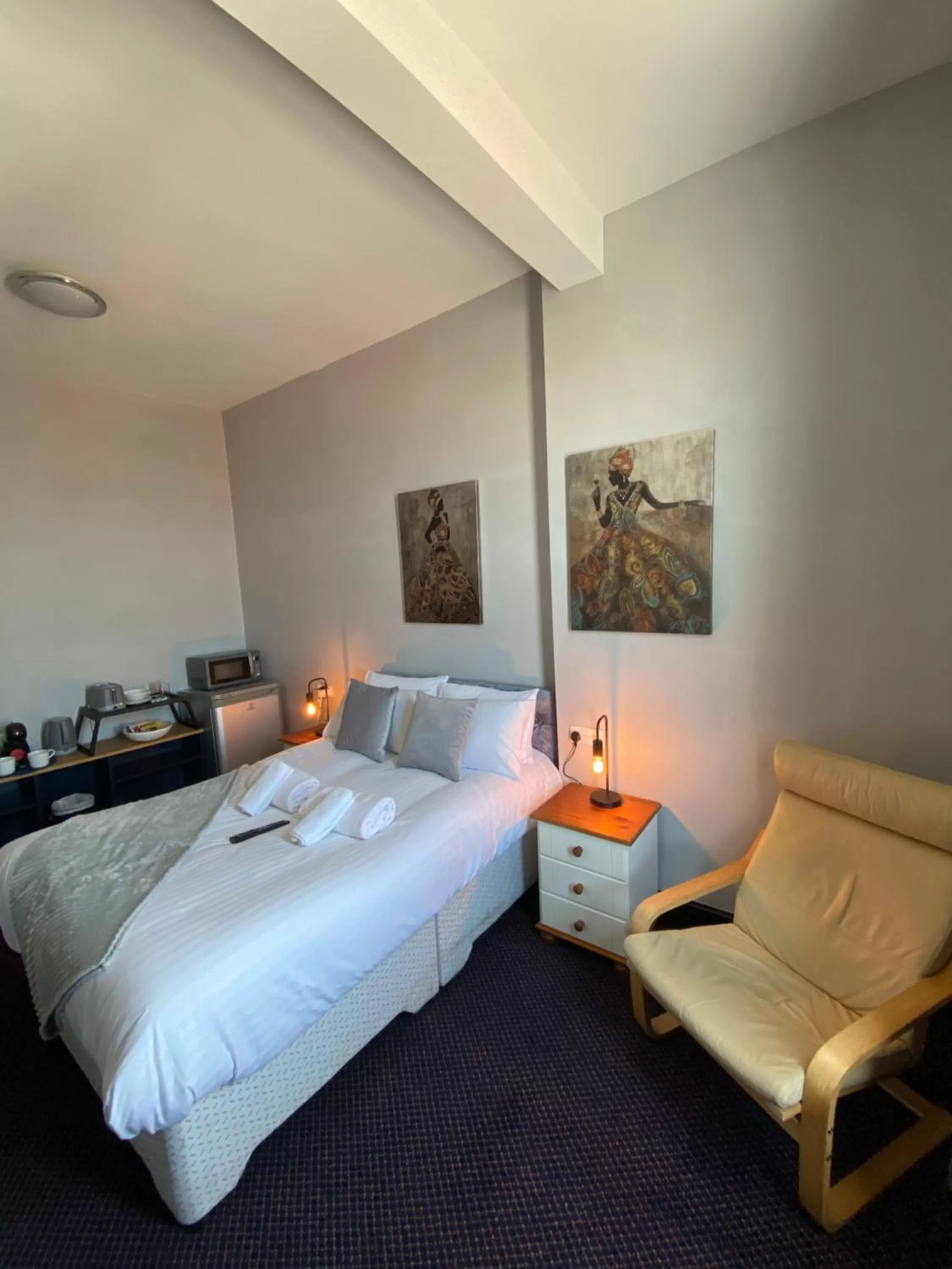 Bed in Bay view rooms at Mentone Hotel