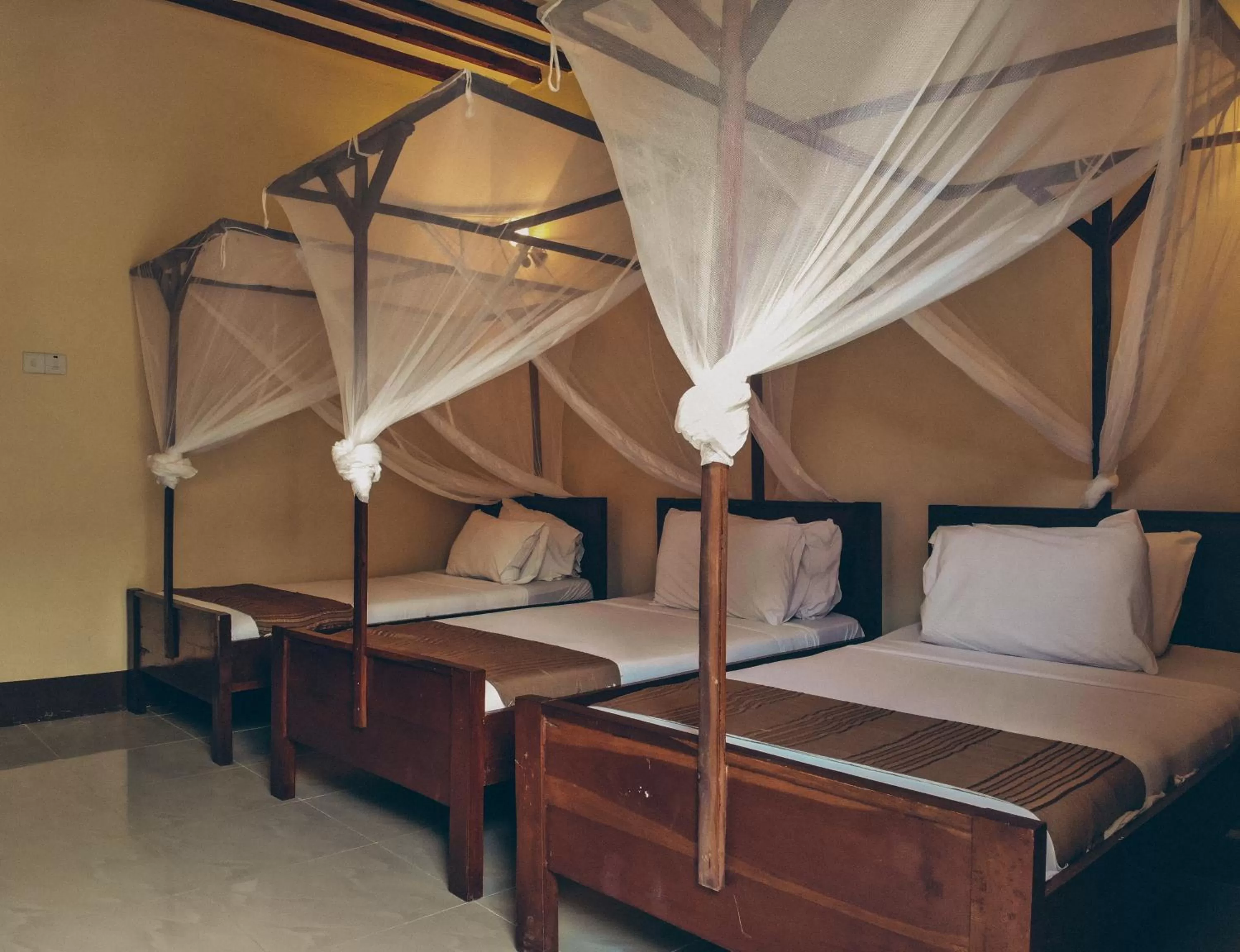 Bed in Amaan Beach Bungalows