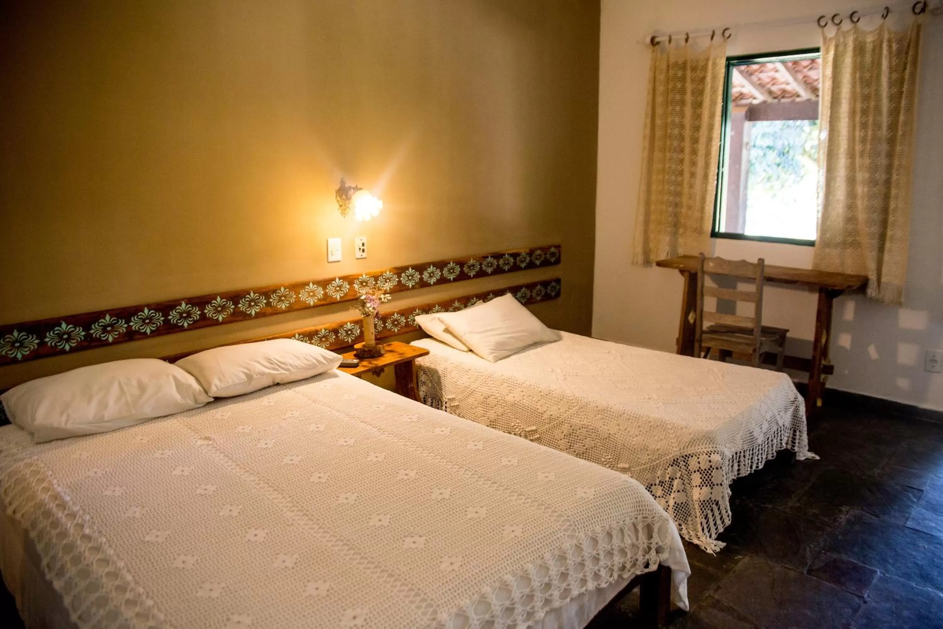 Bed in Pousada Flor da Serra