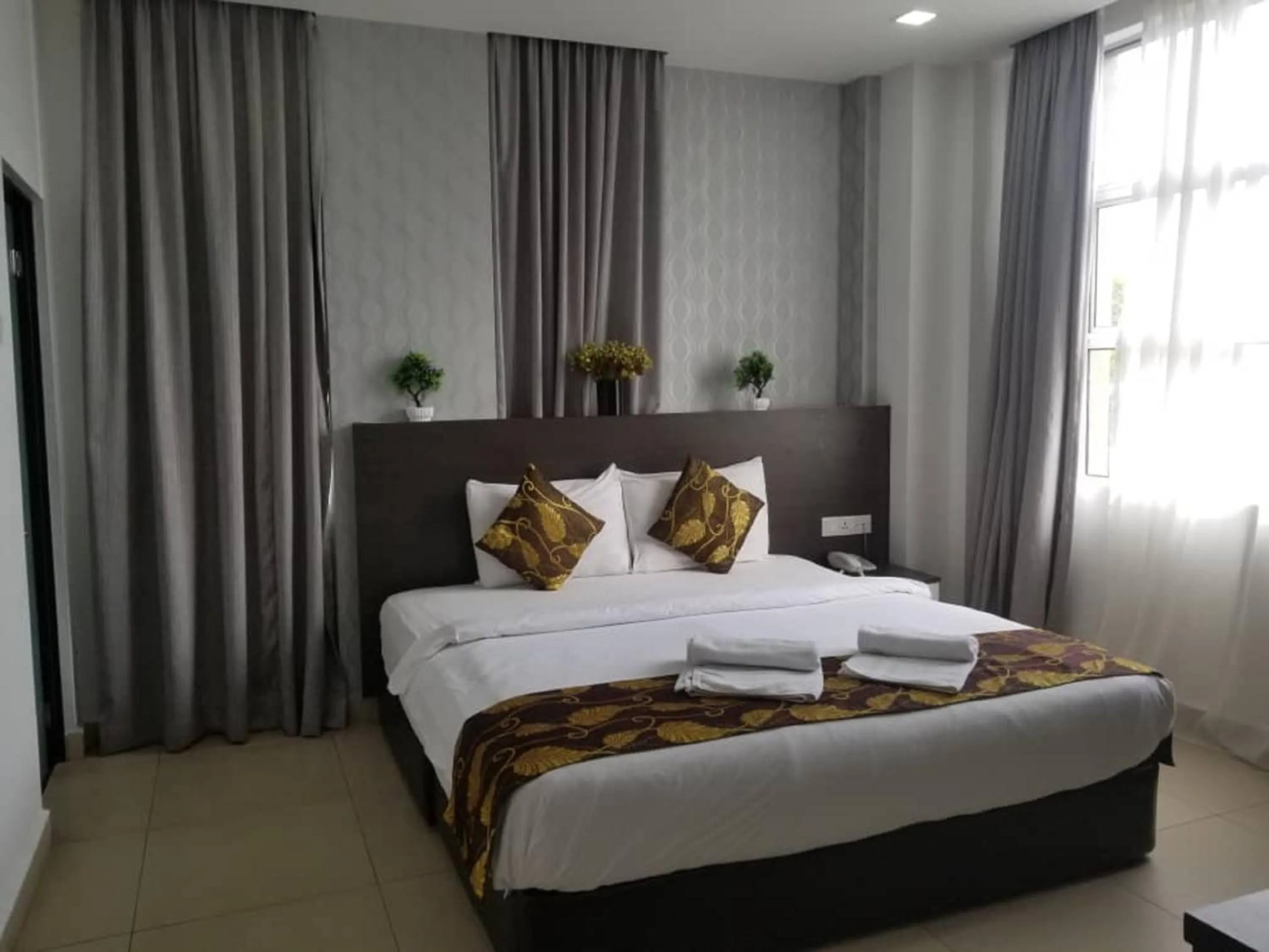 Photo of the whole room, Bed in D'Metro Hotel