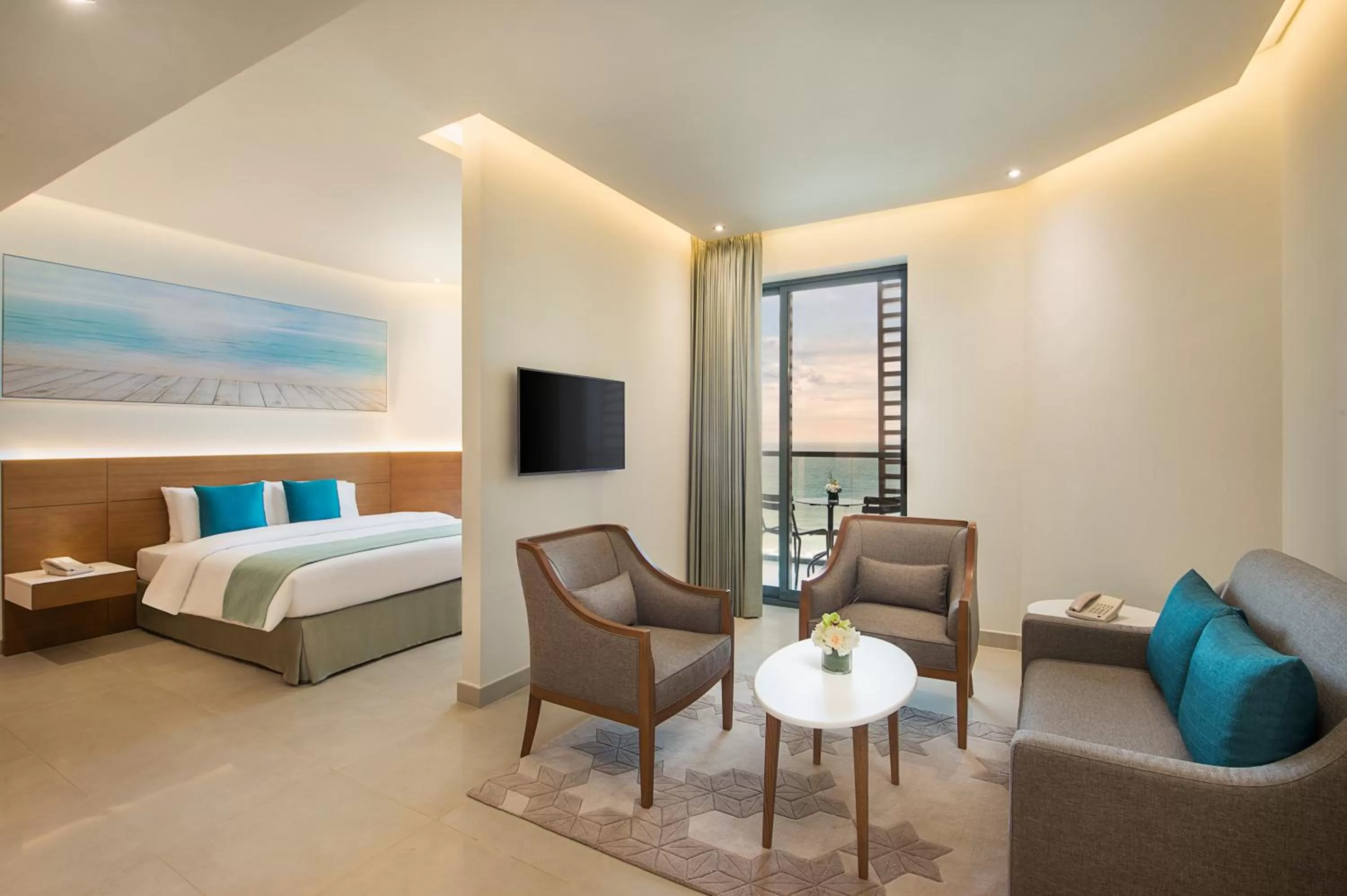 Living room, Bed in Wyndham Garden Ajman Corniche