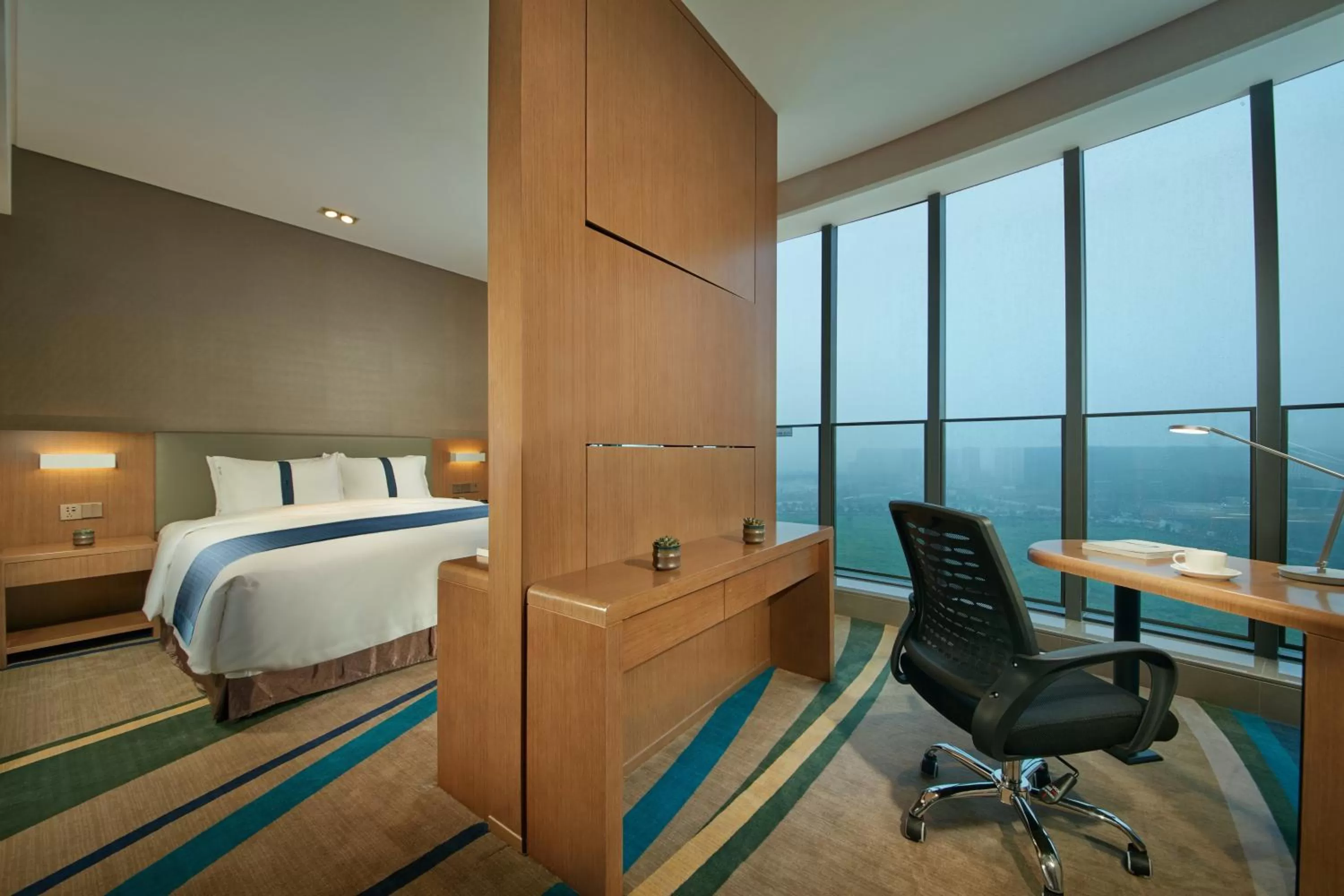 Photo of the whole room, Bed in Holiday Inn Express Hangzhou East Station by IHG