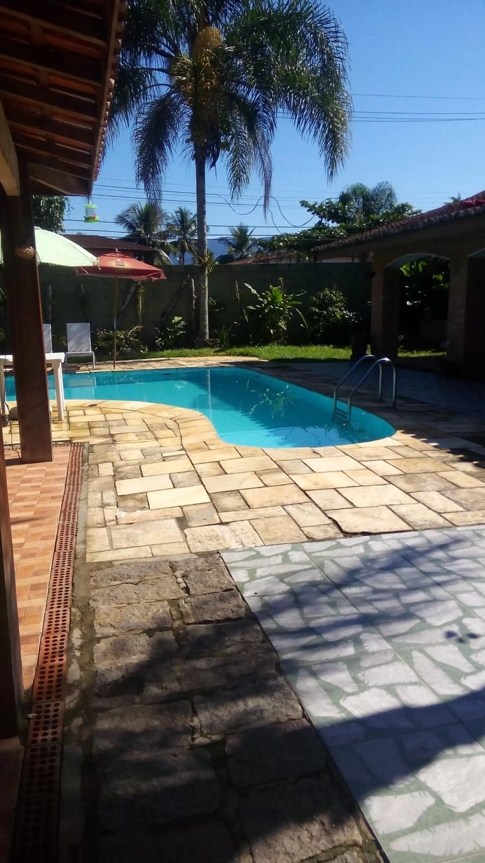 Swimming pool in Pousada Na Praia Ubatuba