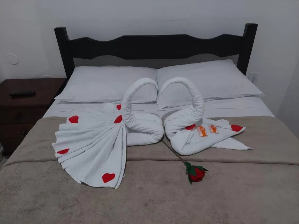 Bed in Pousada Xodó da Praia