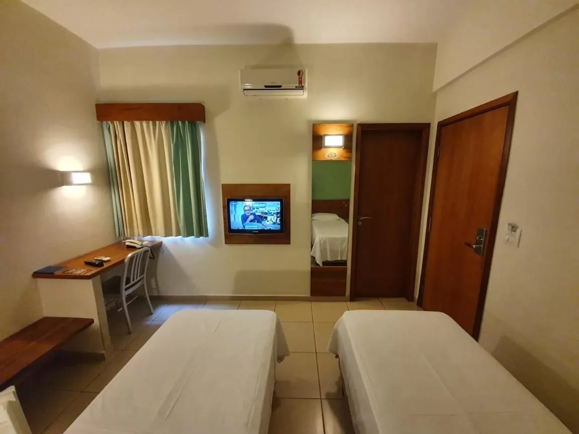 Bed in Meu Hotel Garça