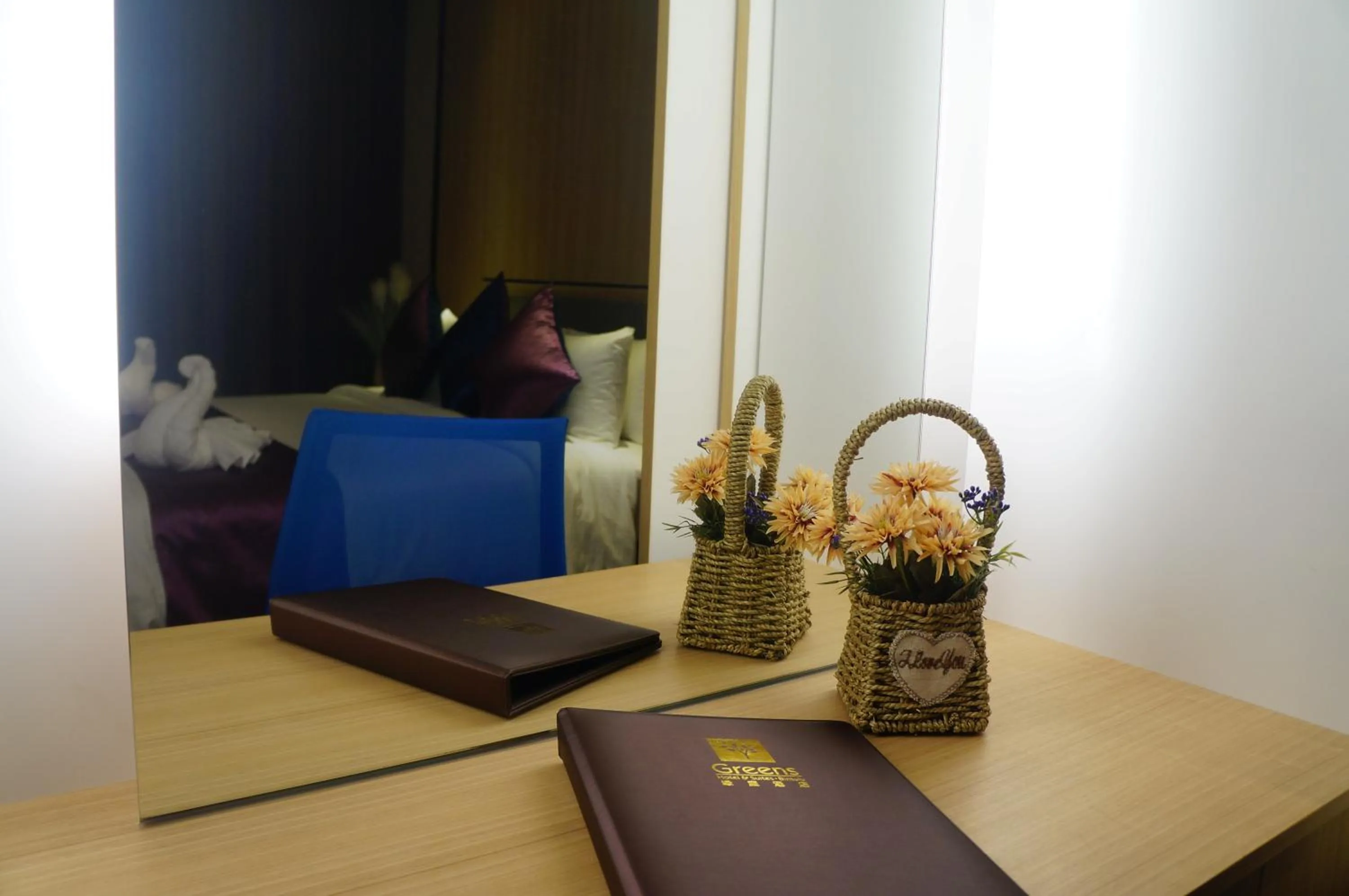 Bedroom in Greens Hotel & Suites