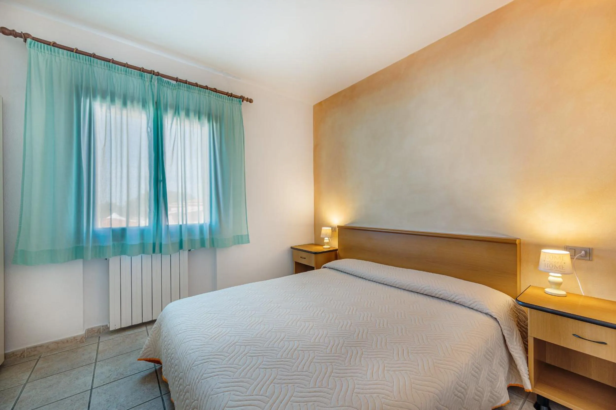 Bed in Marina Manna Hotel and Club Village