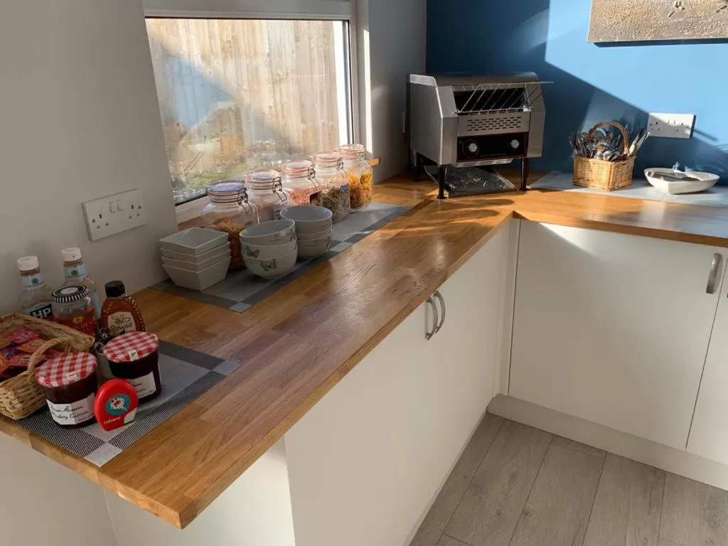 Breakfast, Kitchen/Kitchenette in TRETHEWEY GUEST HOUSE