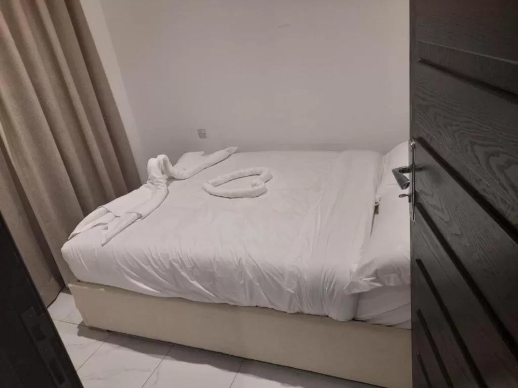 Bed in Atlantis Suites Hotel