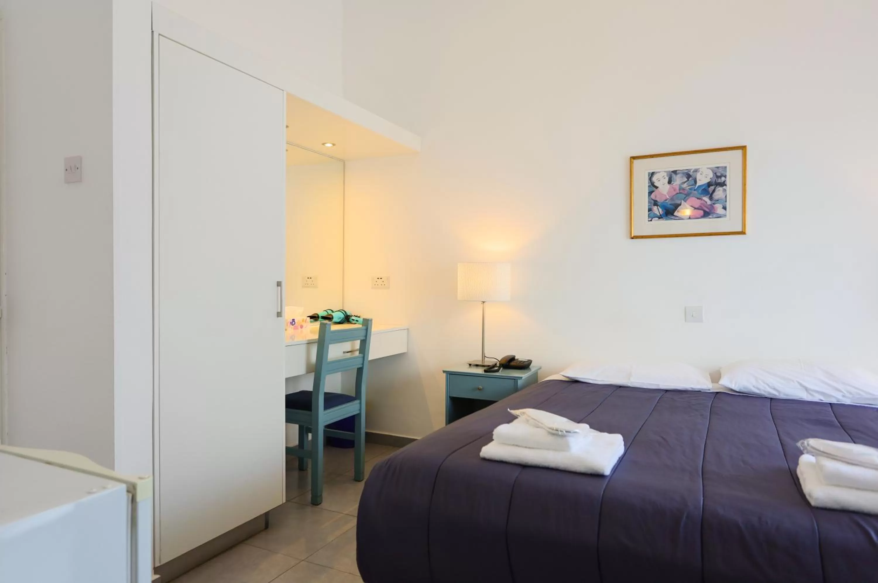 Bed in Axiothea Hotel