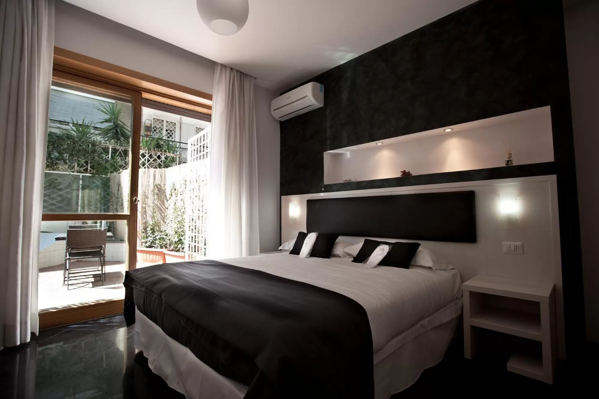 Bed in Heart of Rome Rooms