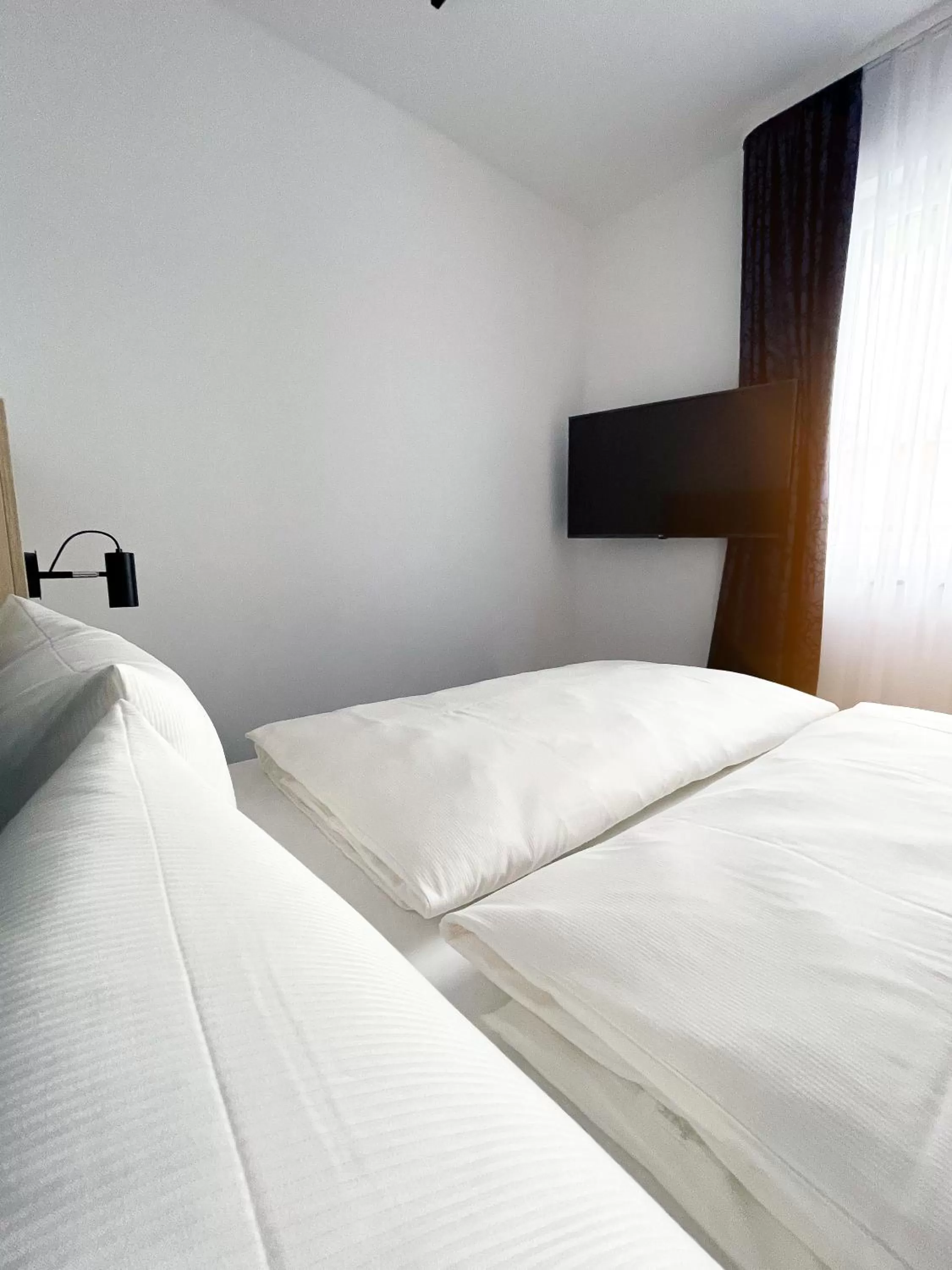 Bed in HOLI City Apart Hotel Berlin