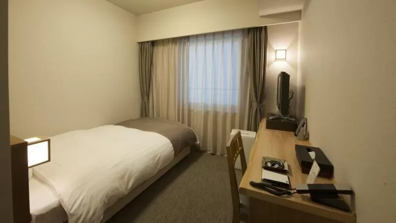Bed in Dormy Inn Tsu