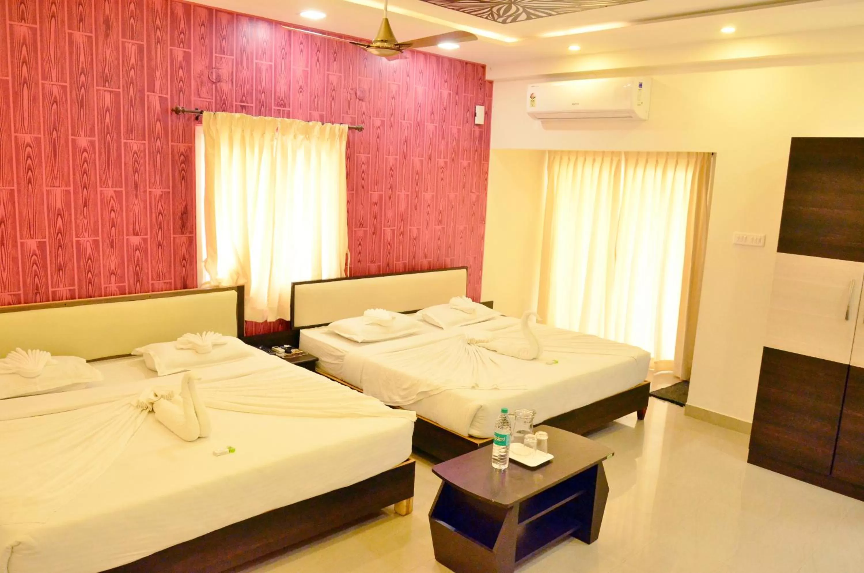 Bed in Hotel Ambai Grand