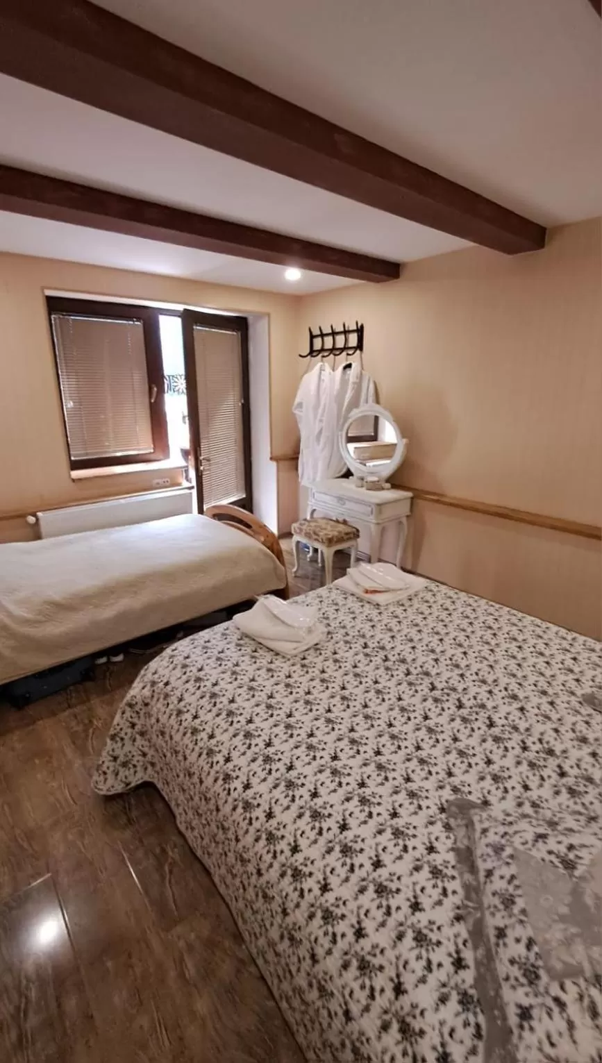 Bed in Qilimcha's Guesthouse