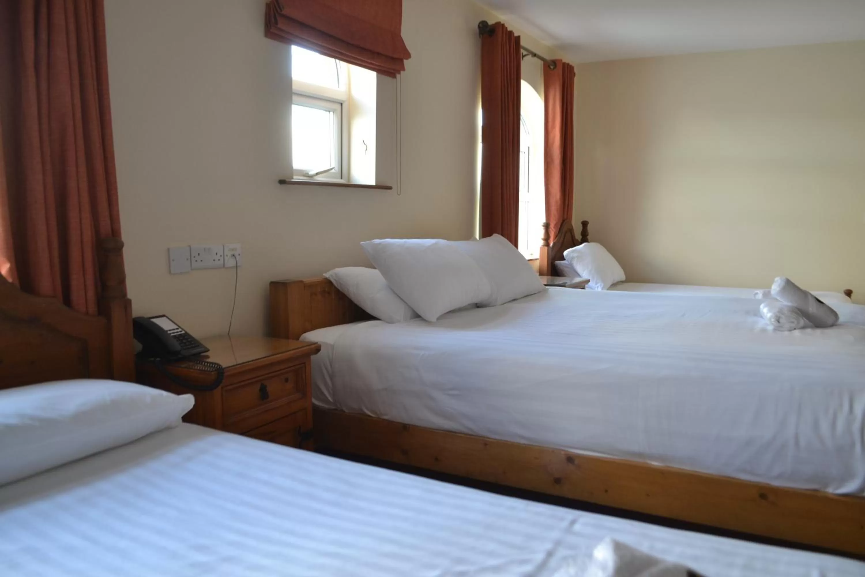 Bed in Walsh's Hotel and Apartments