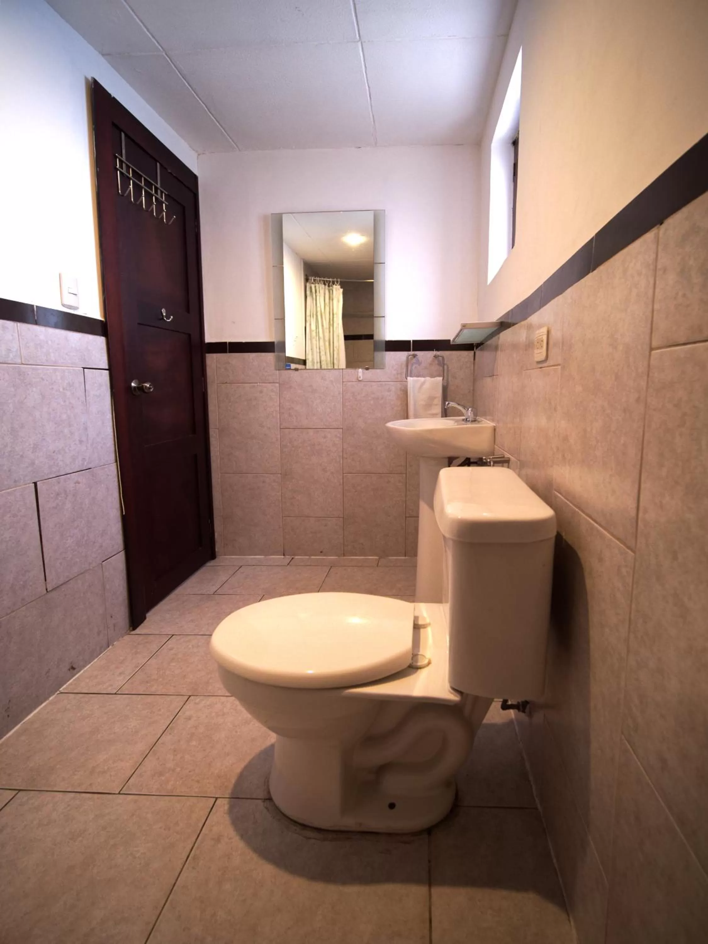Toilet, Bathroom in Apartamentos Otorongo Cuenca Ecuador