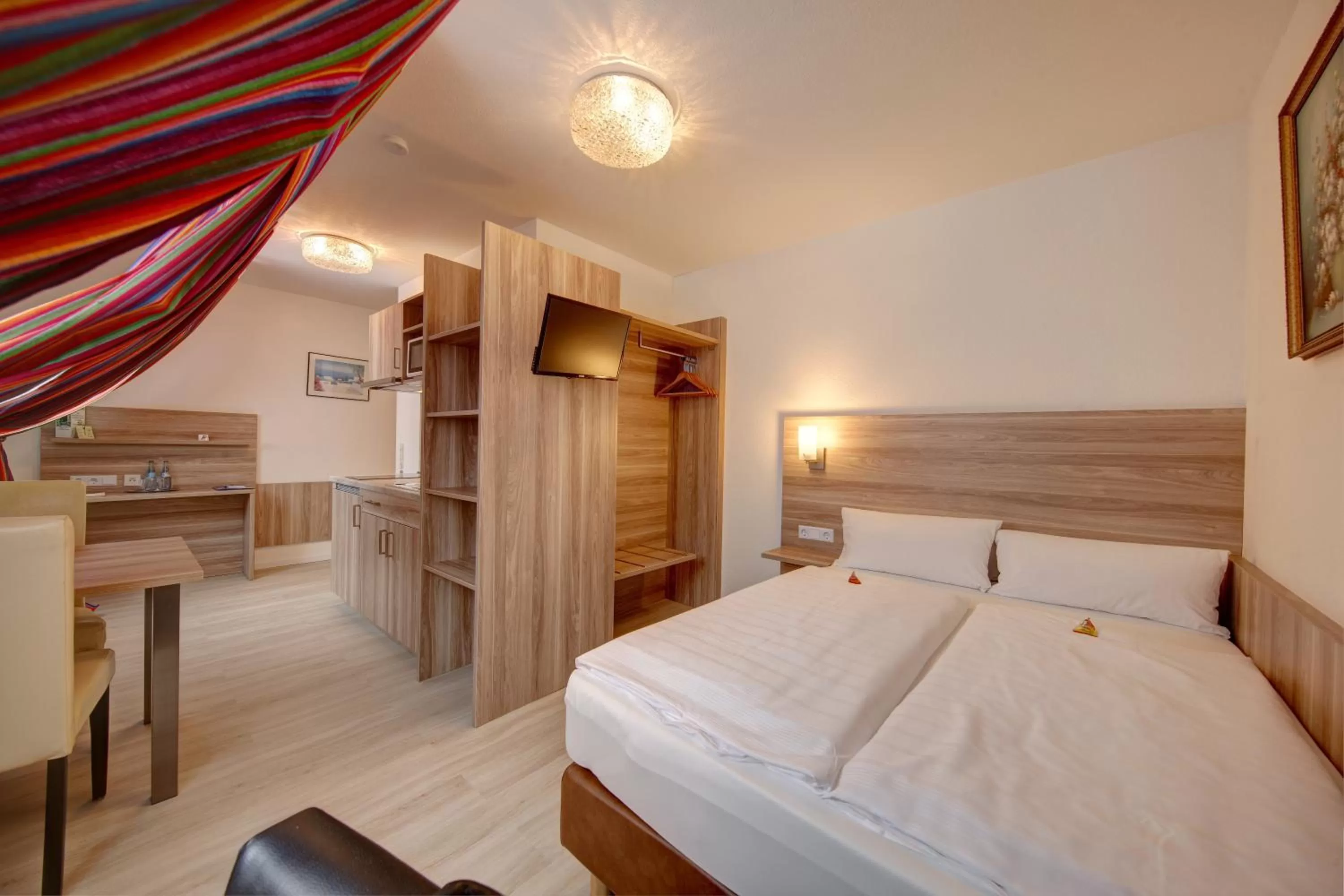 Bed in Aparthotel Deutschmeister