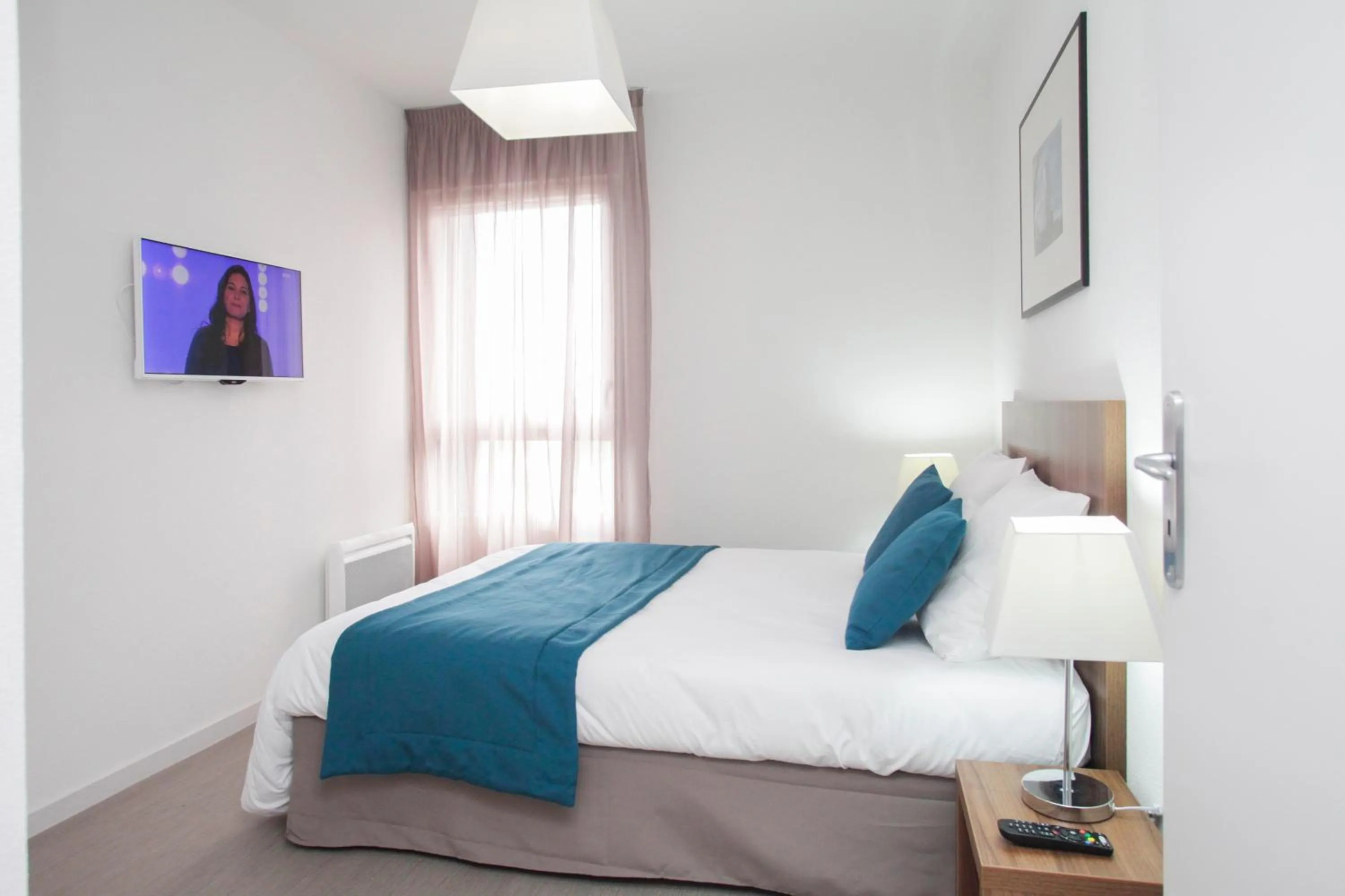 Bedroom, Bed in Appart'hôtel Odalys City - Orléans Centre