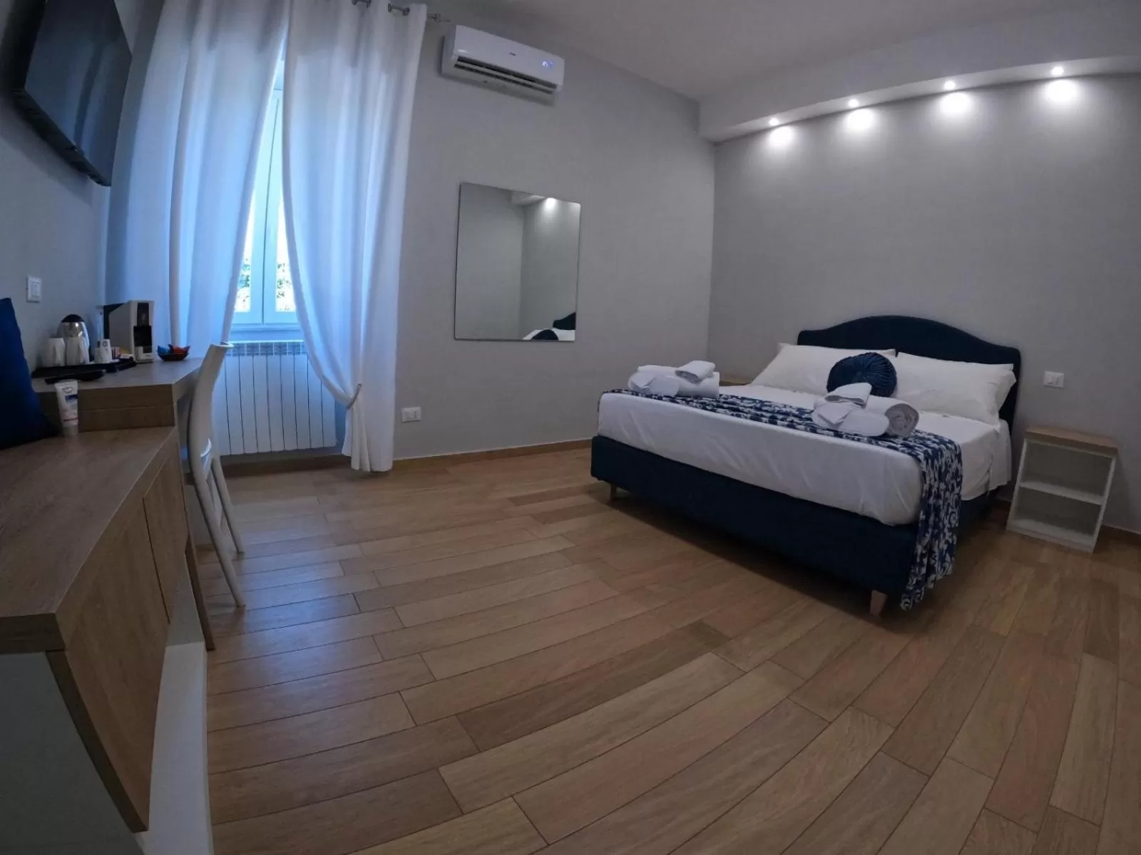 Bed in Nike Luxury Rooms