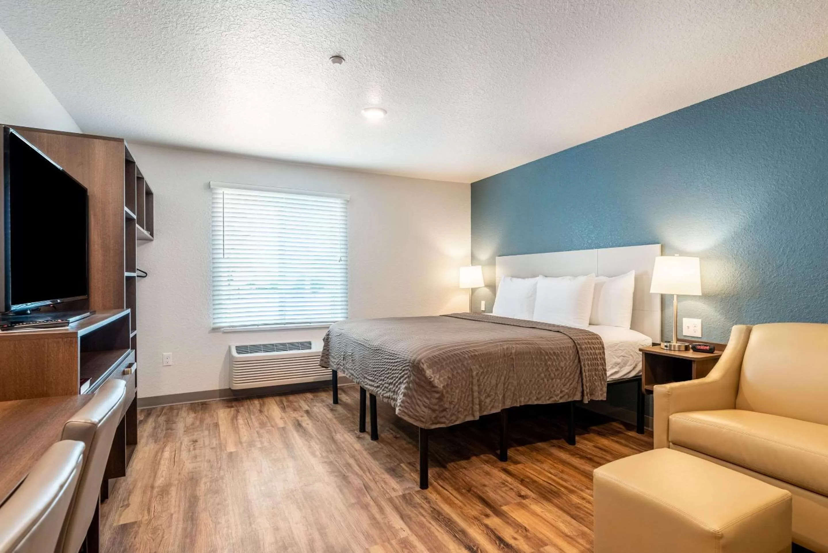 Photo of the whole room, Bed in WoodSpring Suites Sanford North I-4 Orlando Area