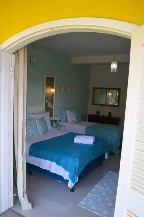 Bed in La Maison Brasiliana B&B