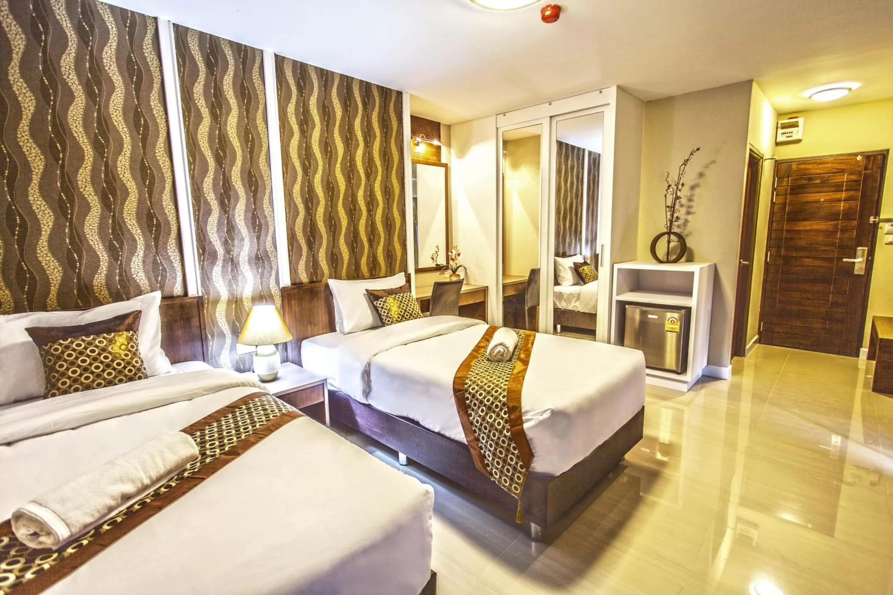 Photo of the whole room, Bed in The Aim Sathorn Hotel