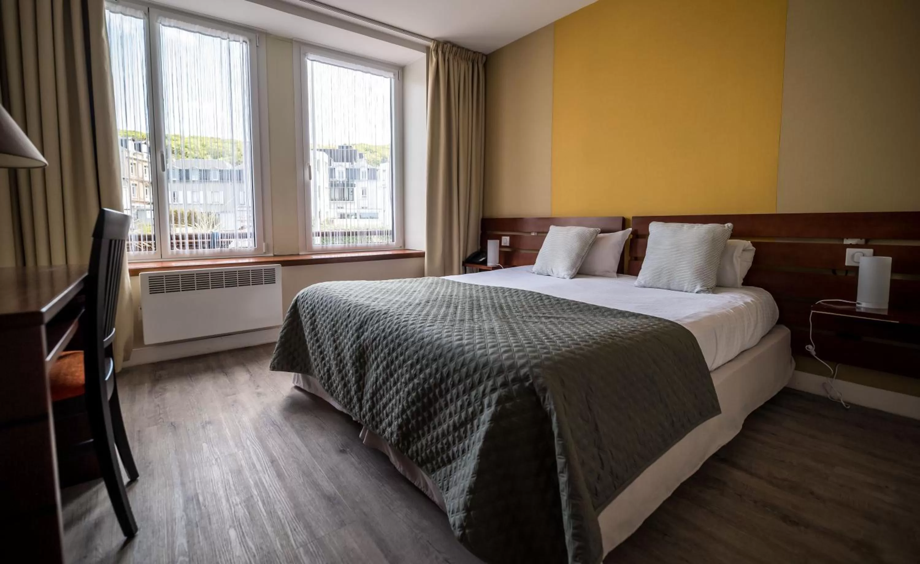 Bed in LOGIS HOTEL - La Petite Rade