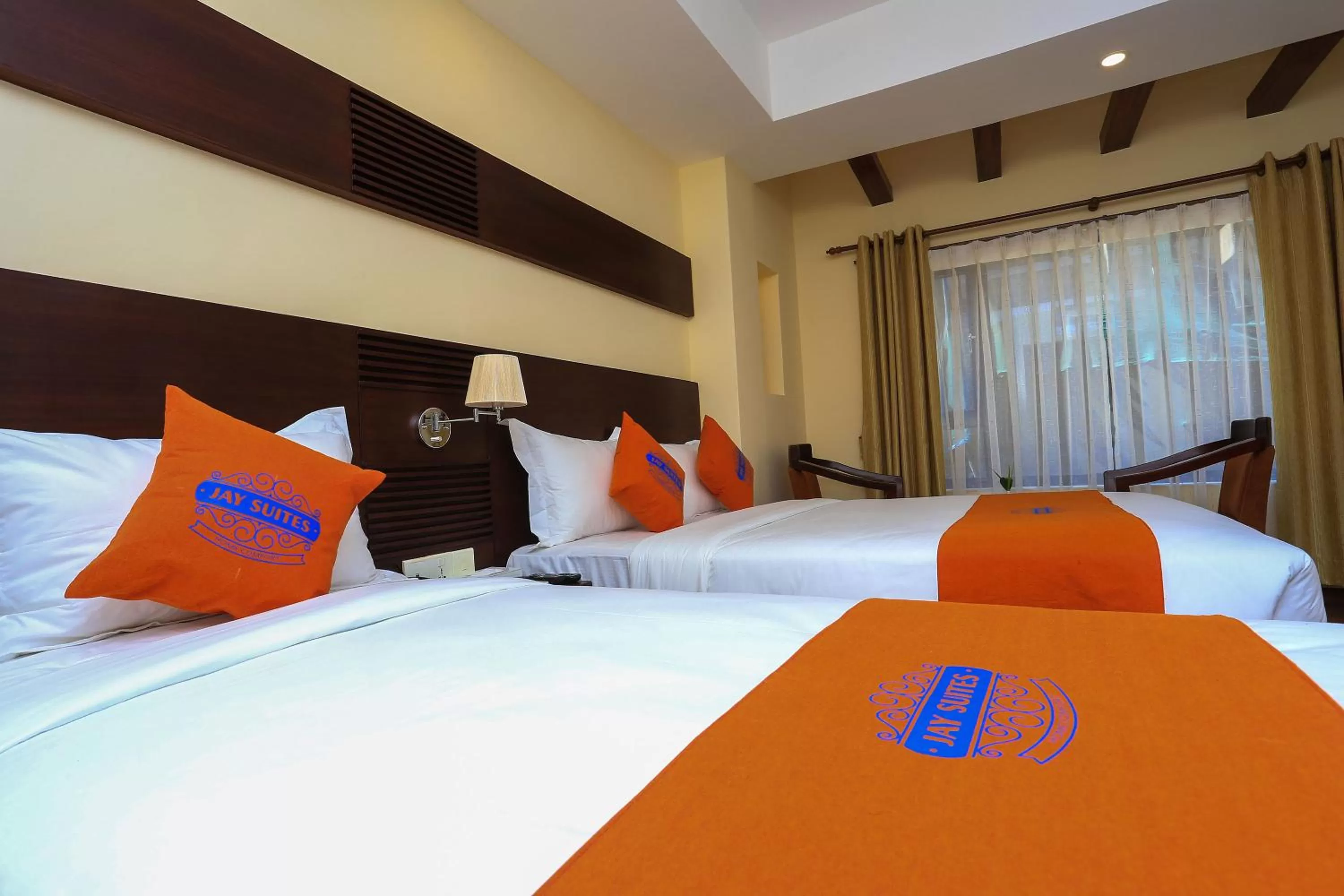 Bed in Hotel Jay Suites