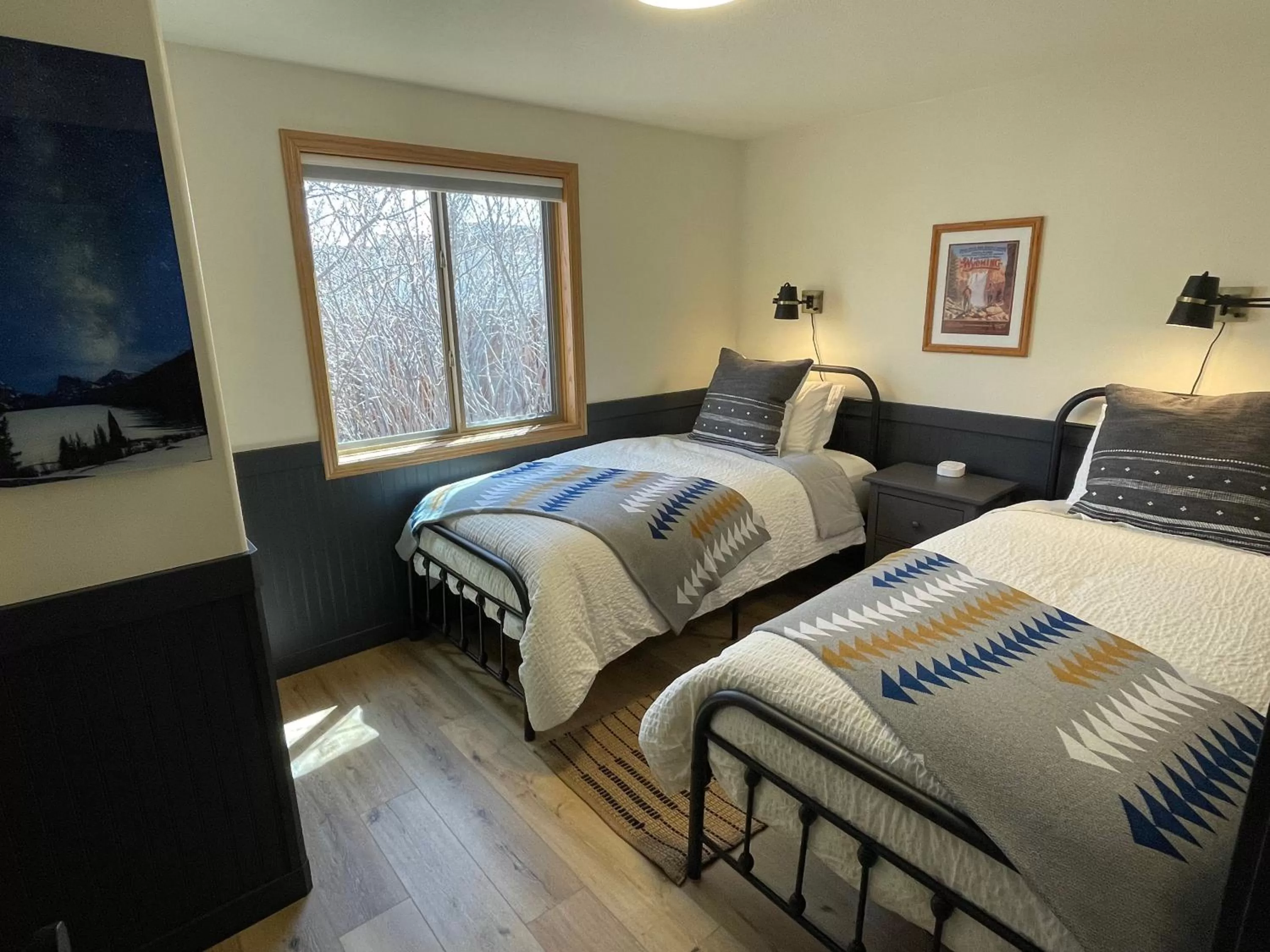 Bed in Pinedale Cozy Cabins