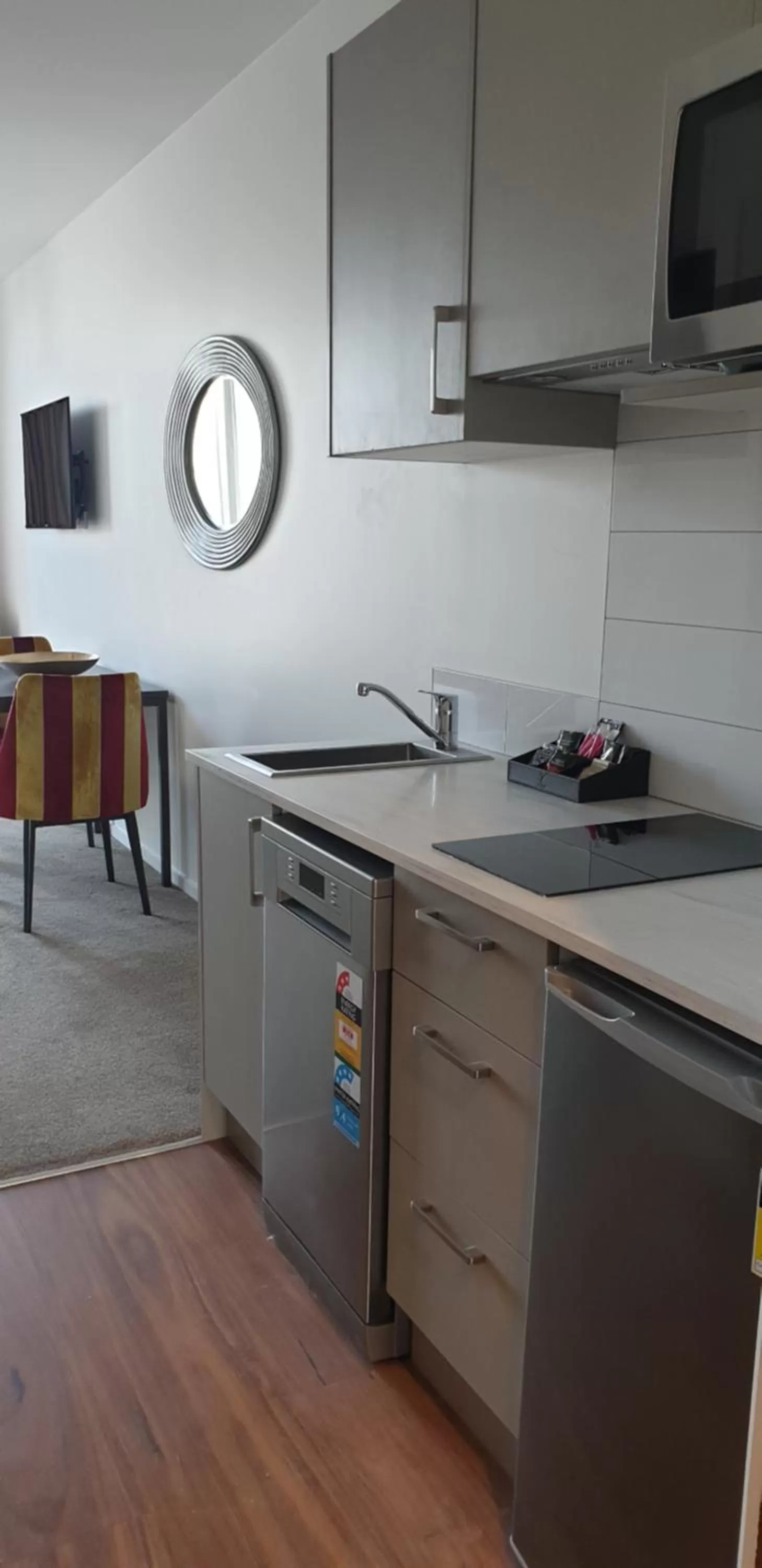 Kitchen or kitchenette in Ramada Suites by Wyndham Auckland Manukau Pacfic Centre