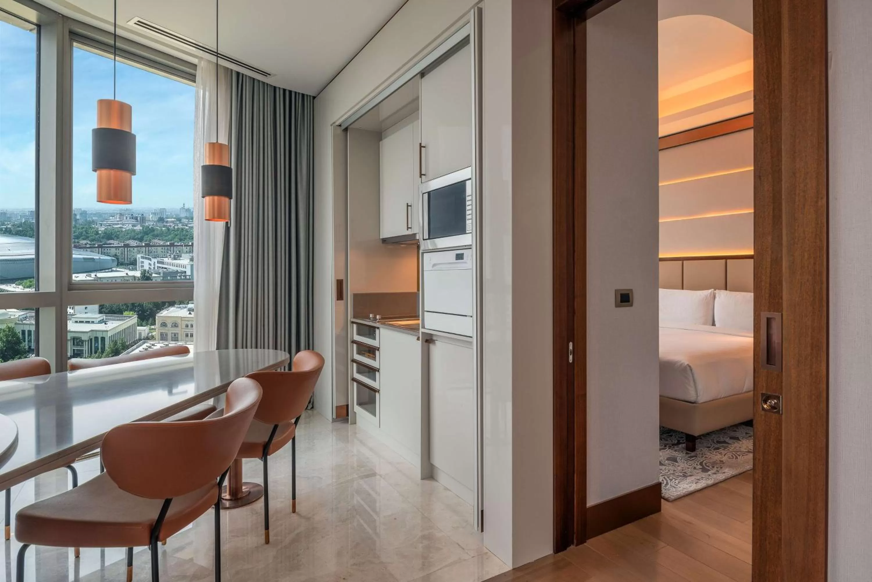 Kitchen or kitchenette, Bed in Hilton Tashkent City