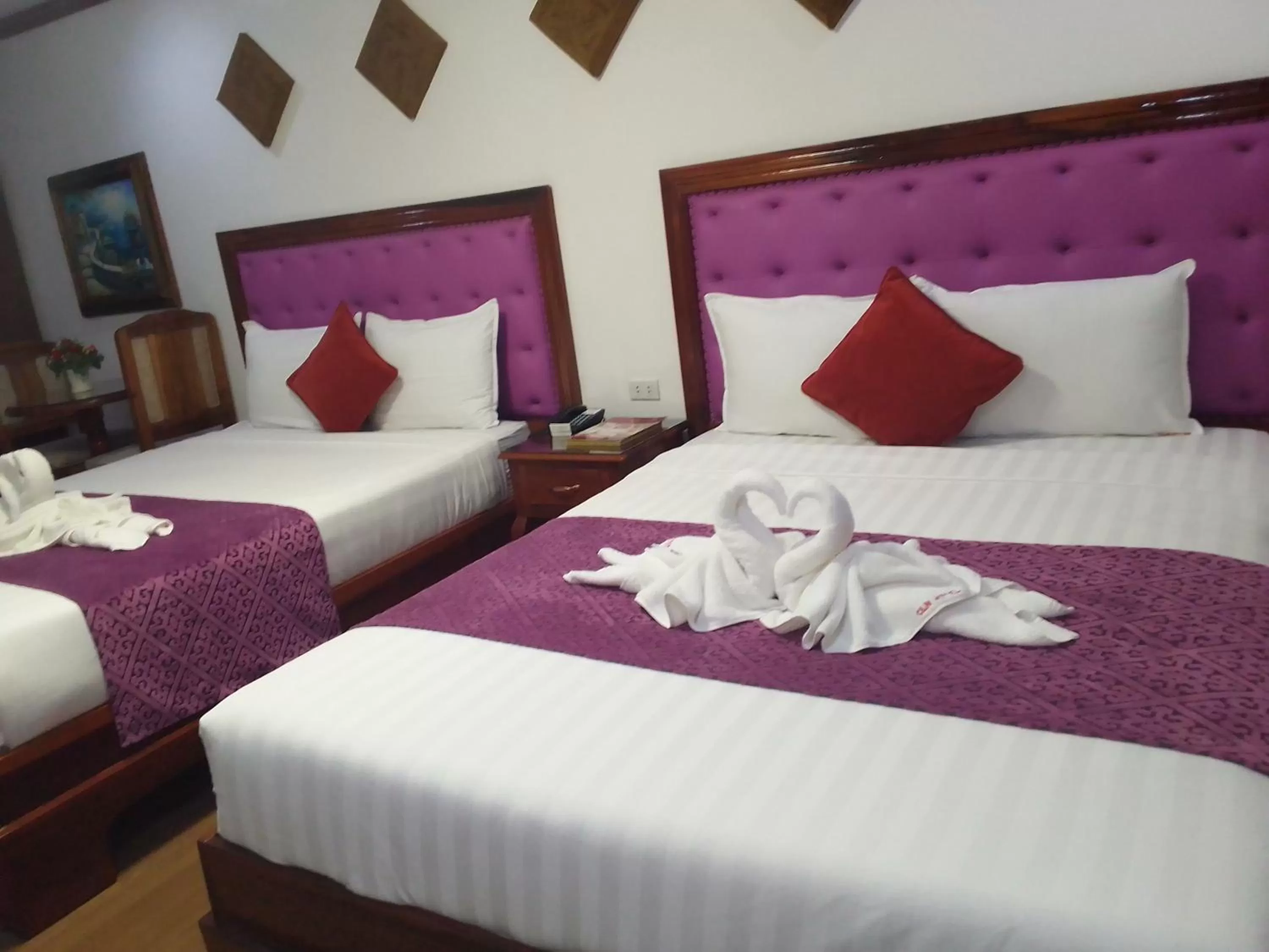 Bed in CLN Boutique Hotel