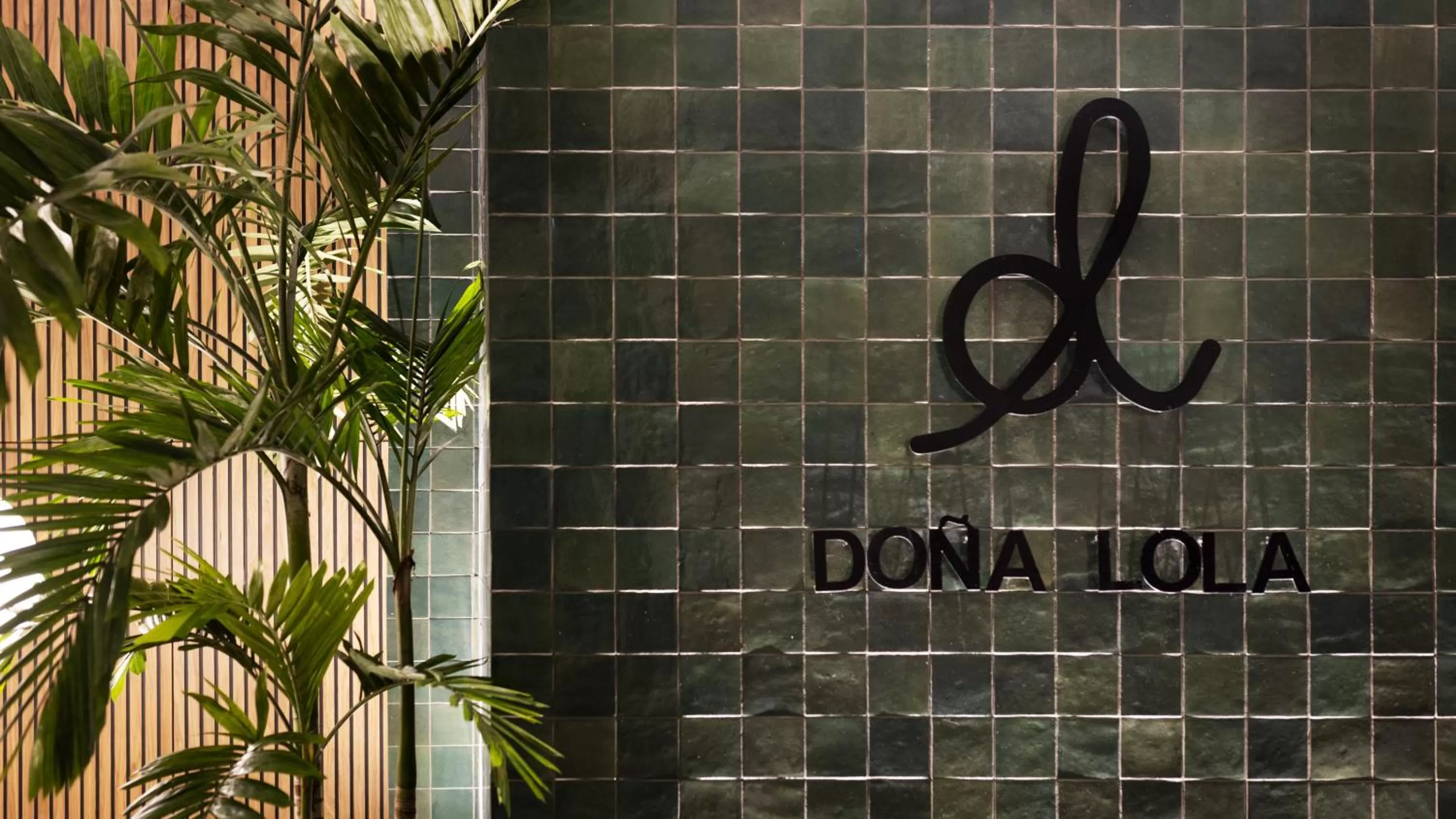 Property logo or sign in Doña Lola Alojamientos Boutique