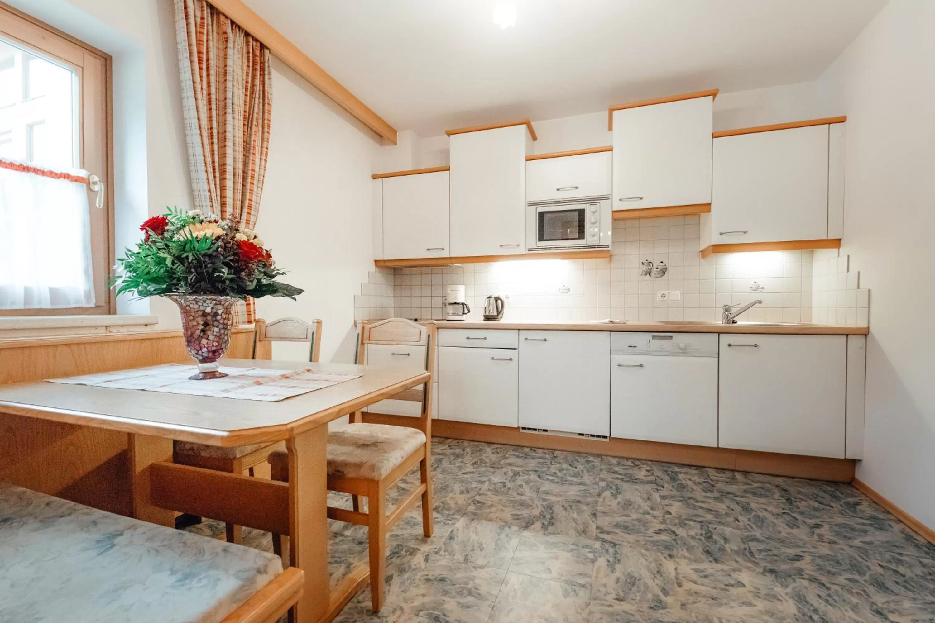 Kitchen or kitchenette in Dandler - Zimmer und Ferienwohnungen