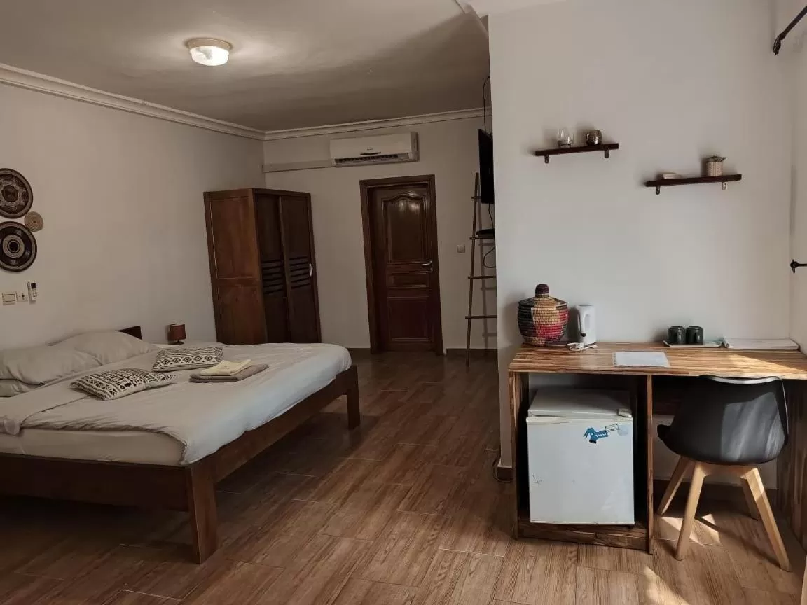 Bed in L'Oasis Guesthouse