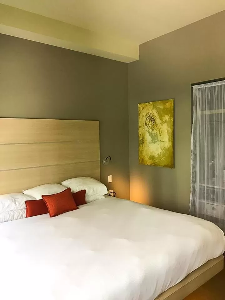 Bed in CityFlatsHotel - Grand Rapids, an Ascend Collection Hotel