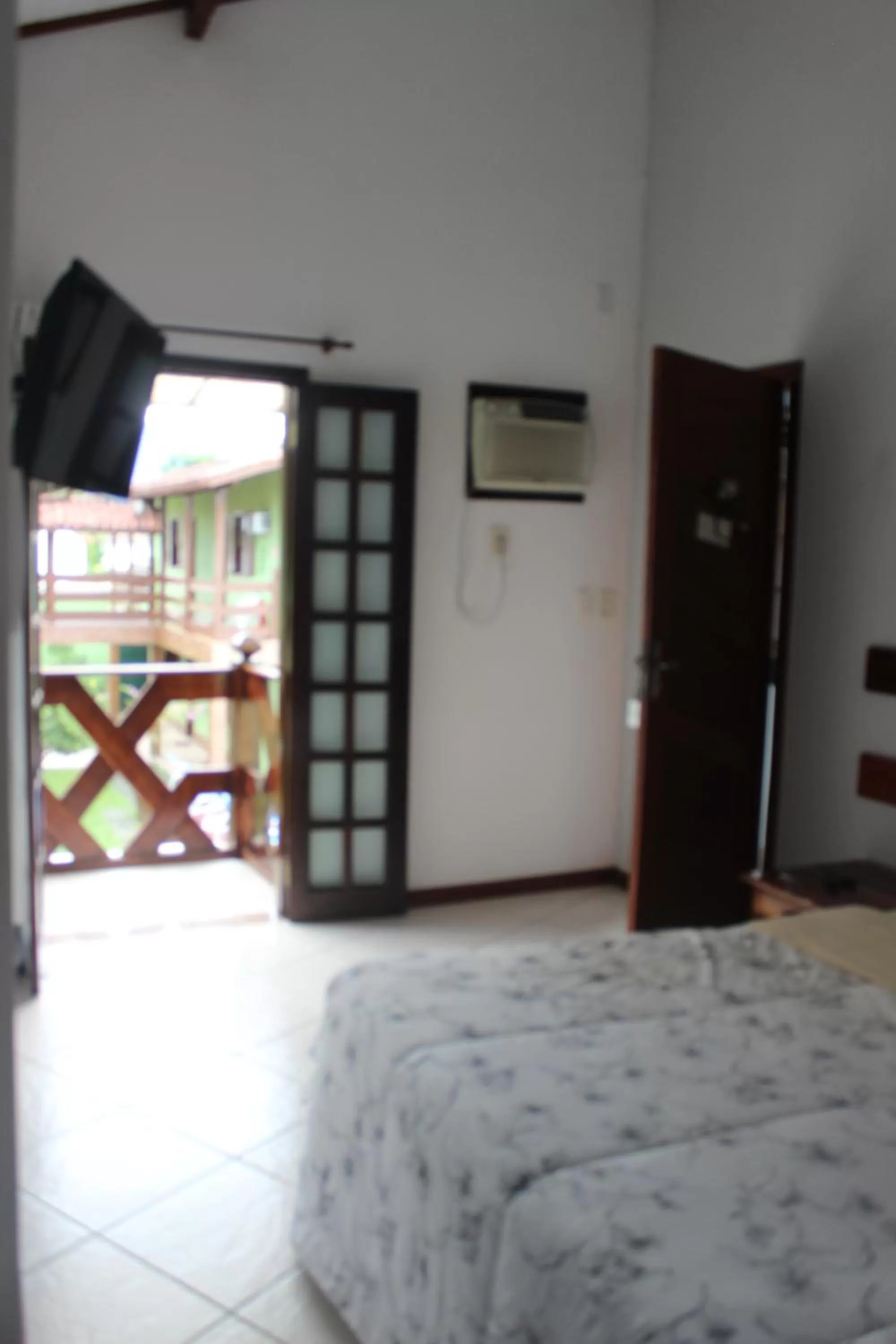 Bed in Pousada Flor de Paraty