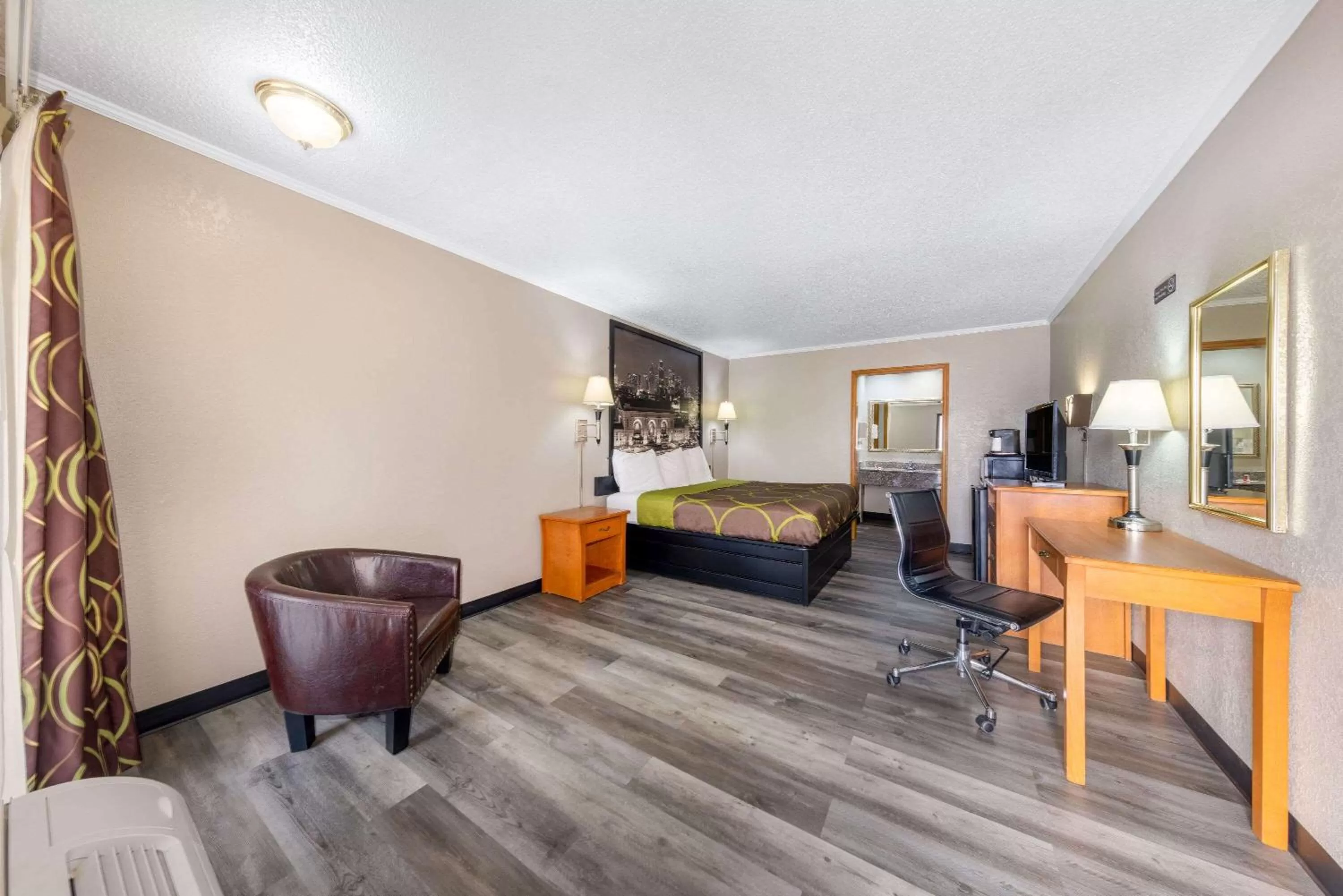 Bedroom in Super 8 by Wyndham Kansas City Airport North