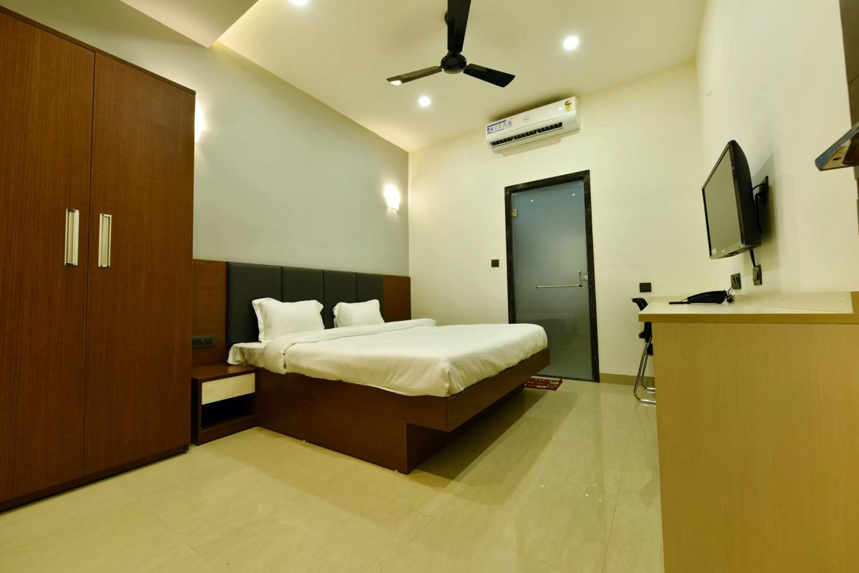 Bed in Hotel Nikhil Regency