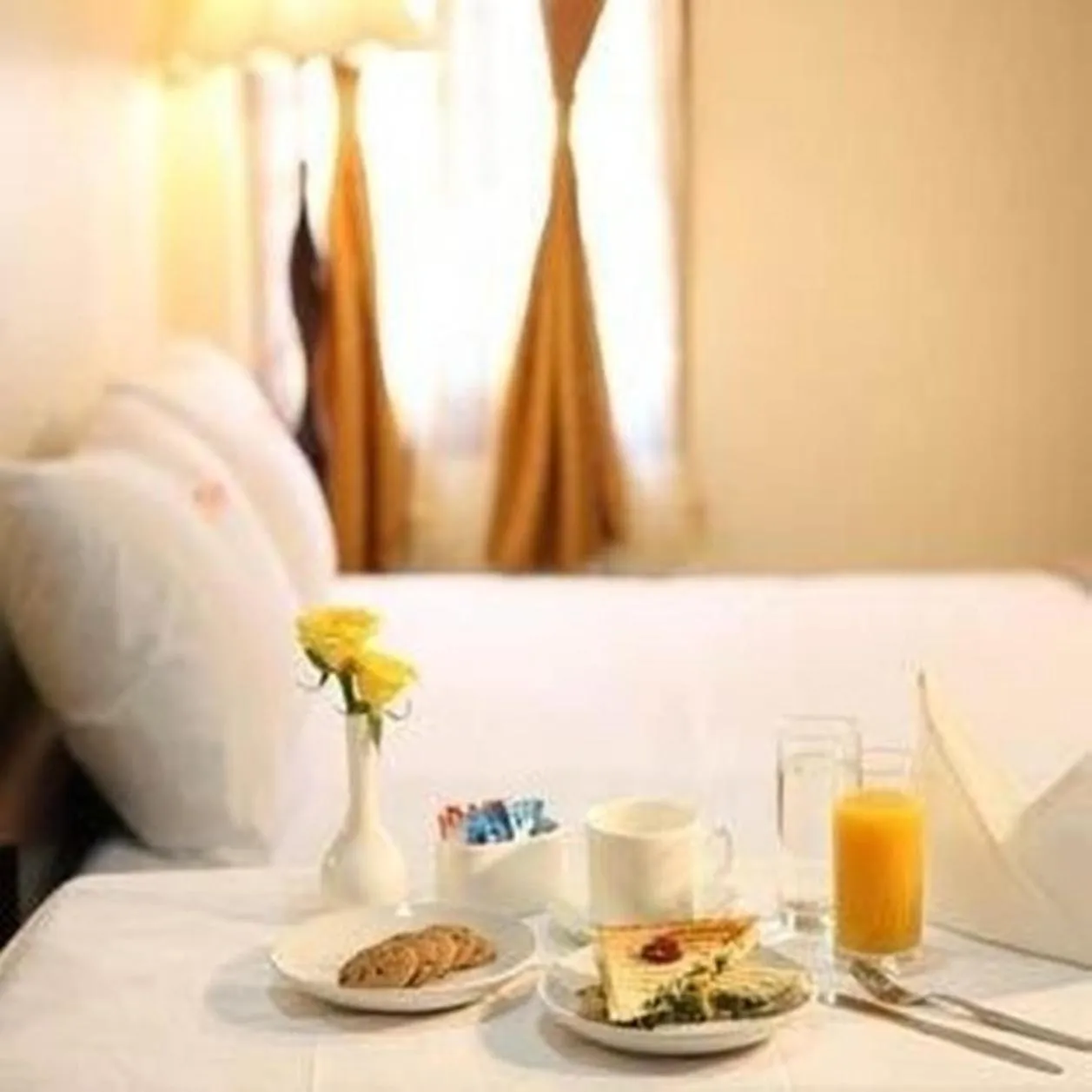 Bed in Meenakshi's Sunshine Hotel