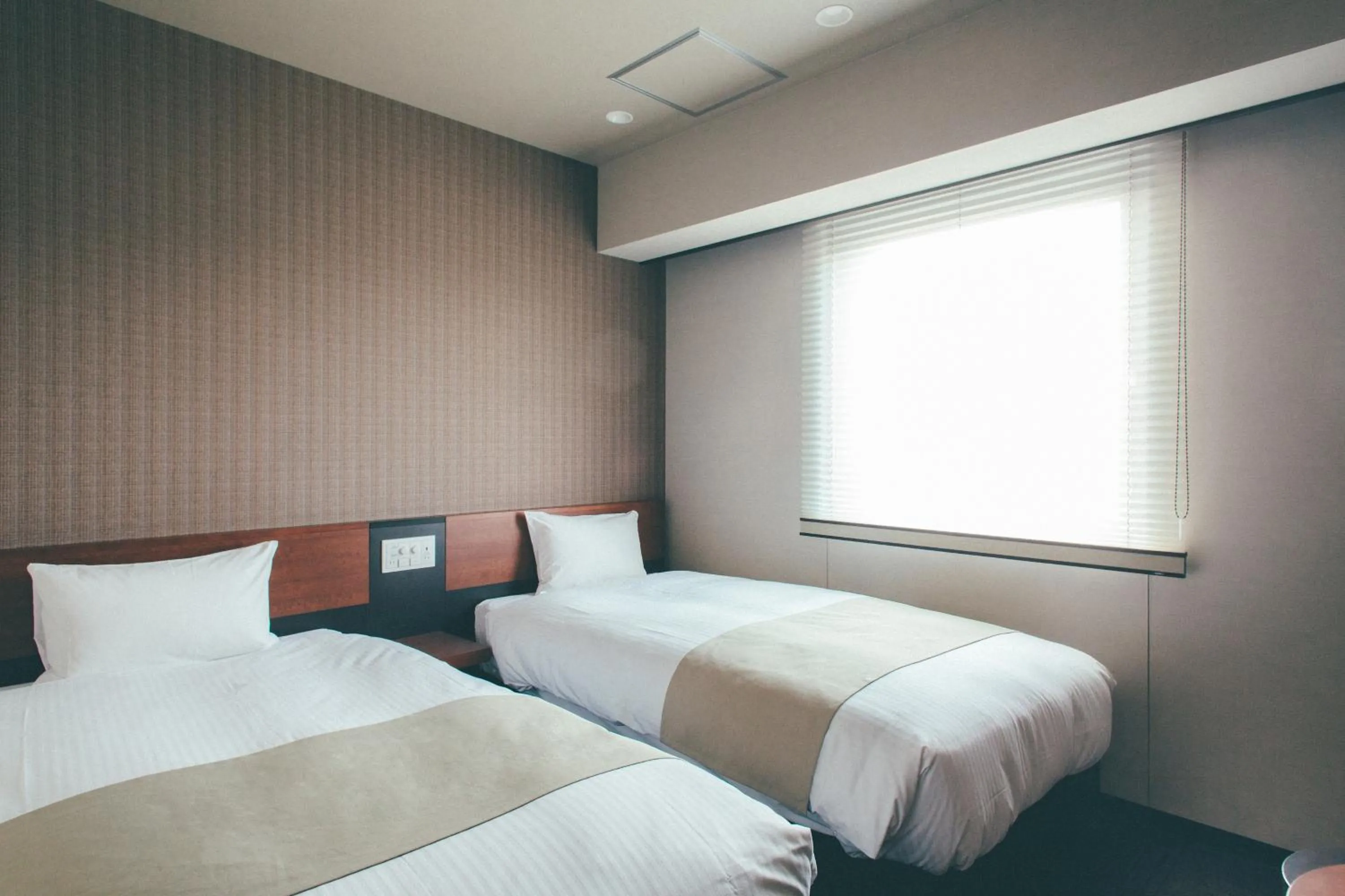 Bed in Hotel Kuretakeso Takayama Ekimae