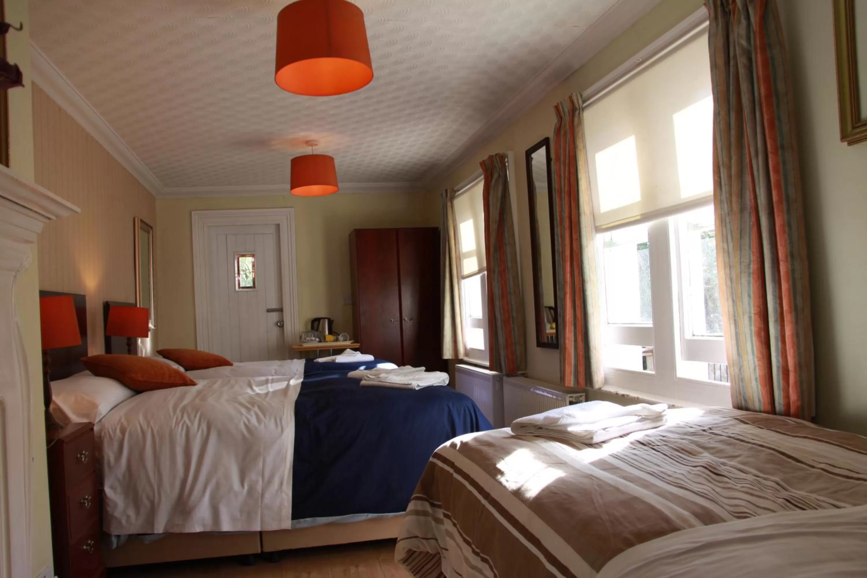 Bed in Ambassador Hotel