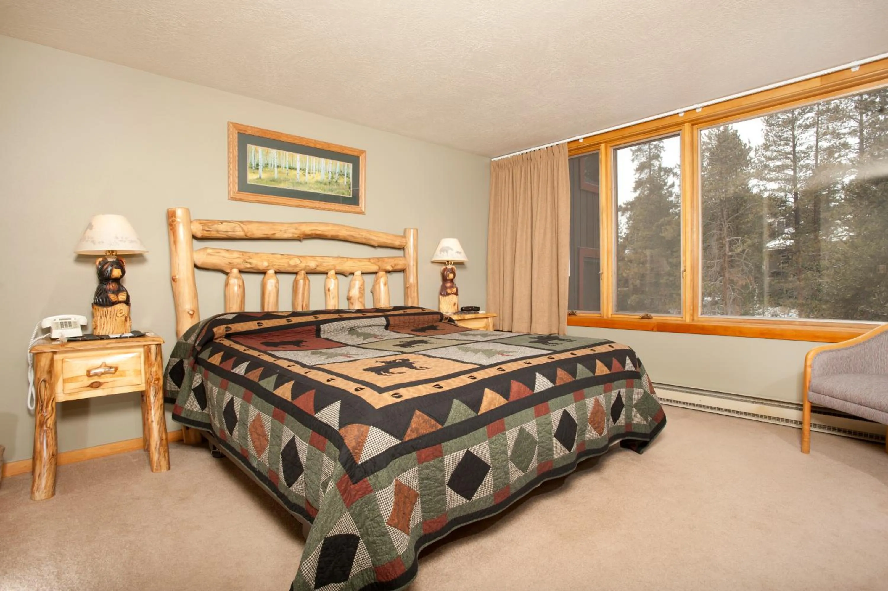 Bed in Evergreen Condominiums by Vail Resorts