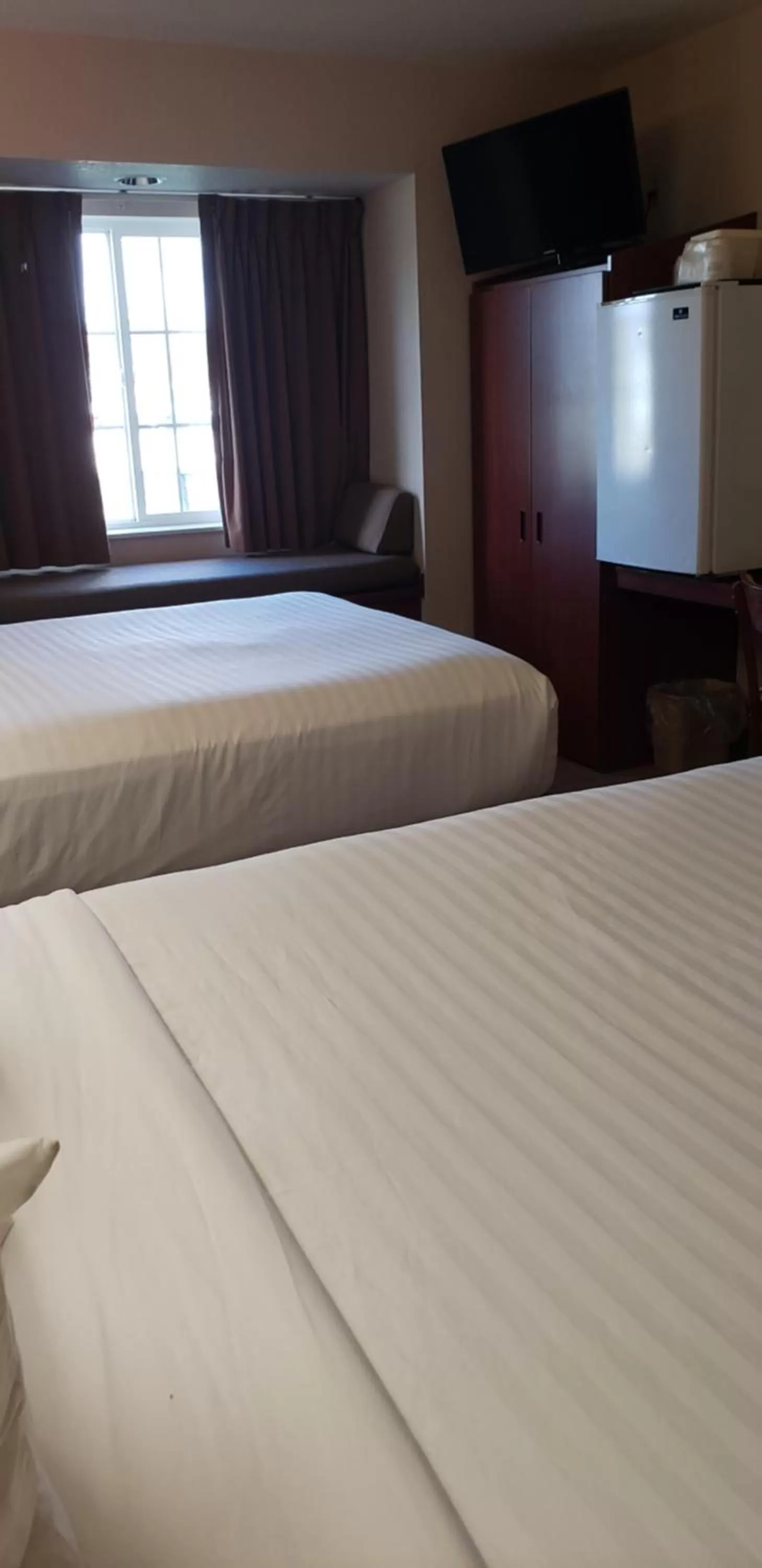 Queen Room with Two Queen Beds - Non-Smoking in Microtel Inn & Suites by Wyndham Wellsville