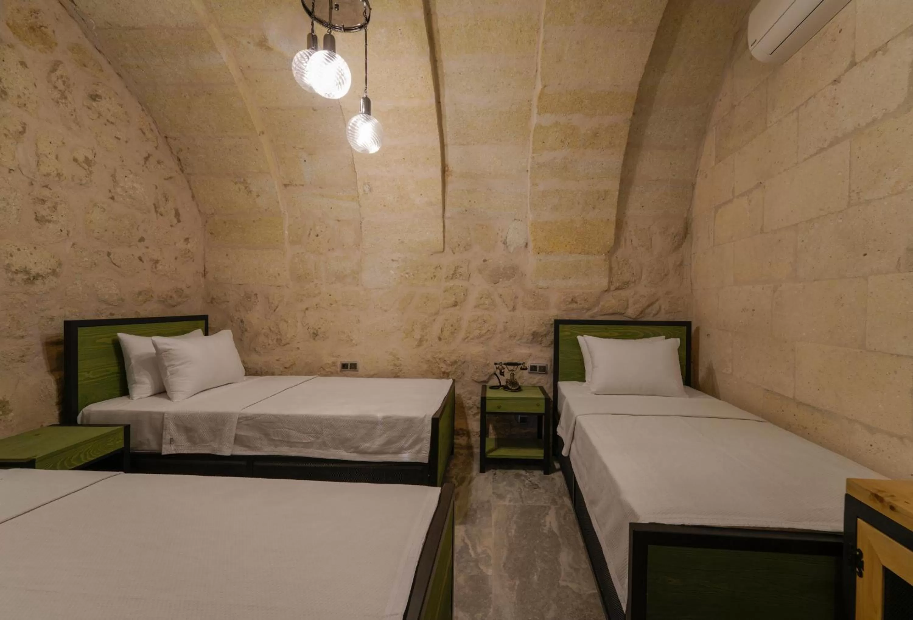 Bed in The Niche Cave Hotel