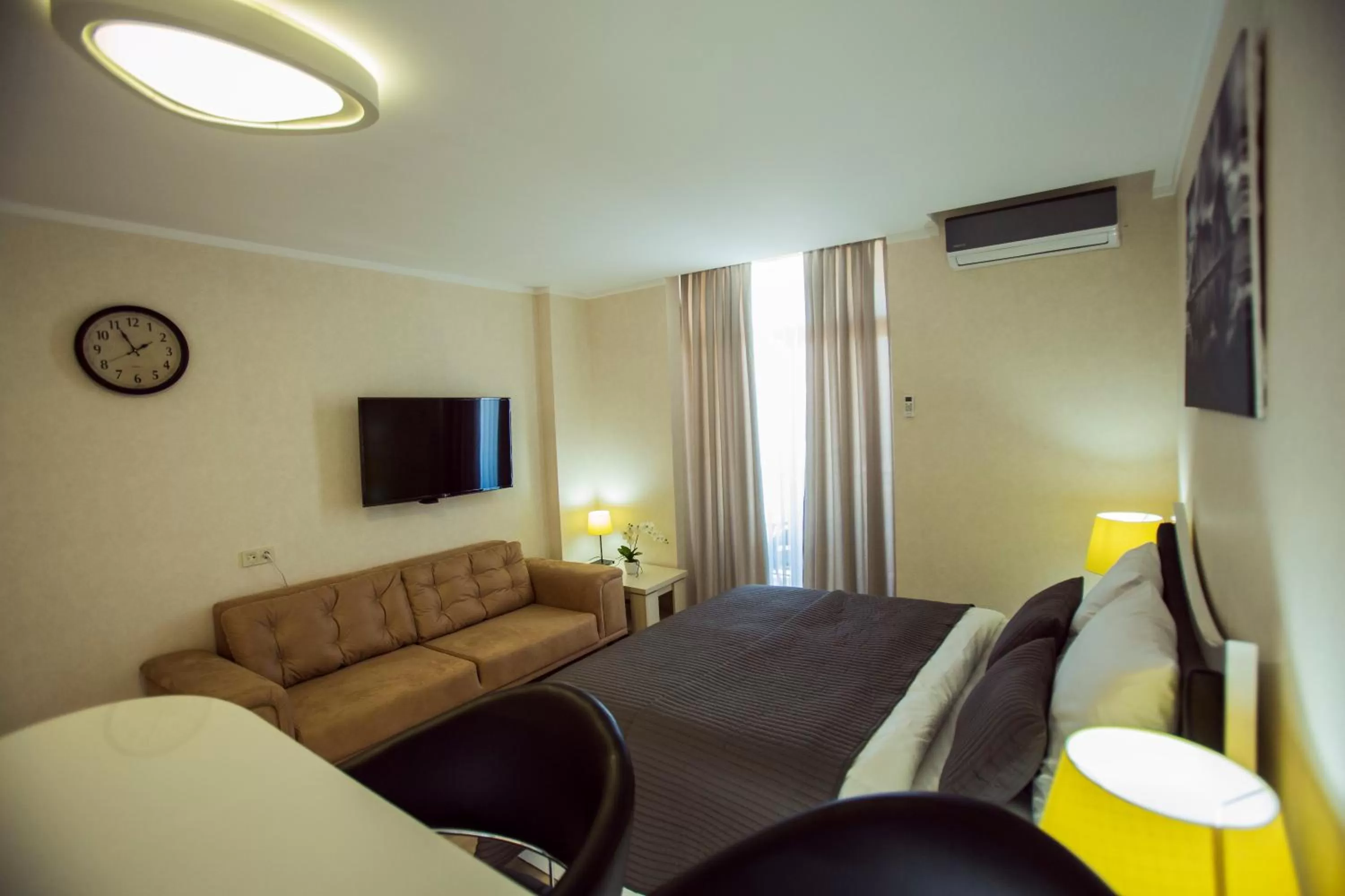Bed, Seating Area in Aparthotel Holiday Lux Batumi